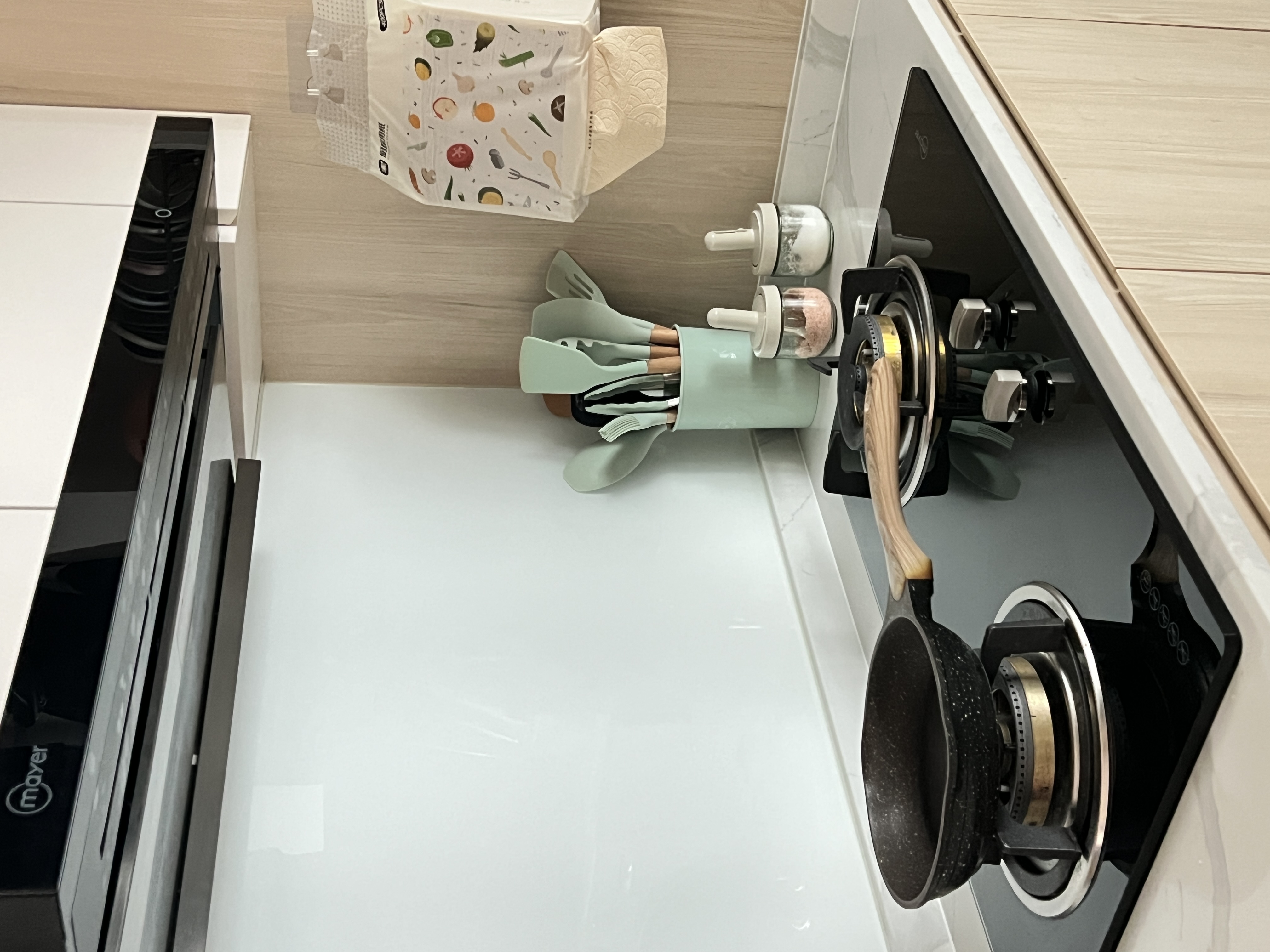 Our cozy little space - featuring our kitchen sink, hod and hood