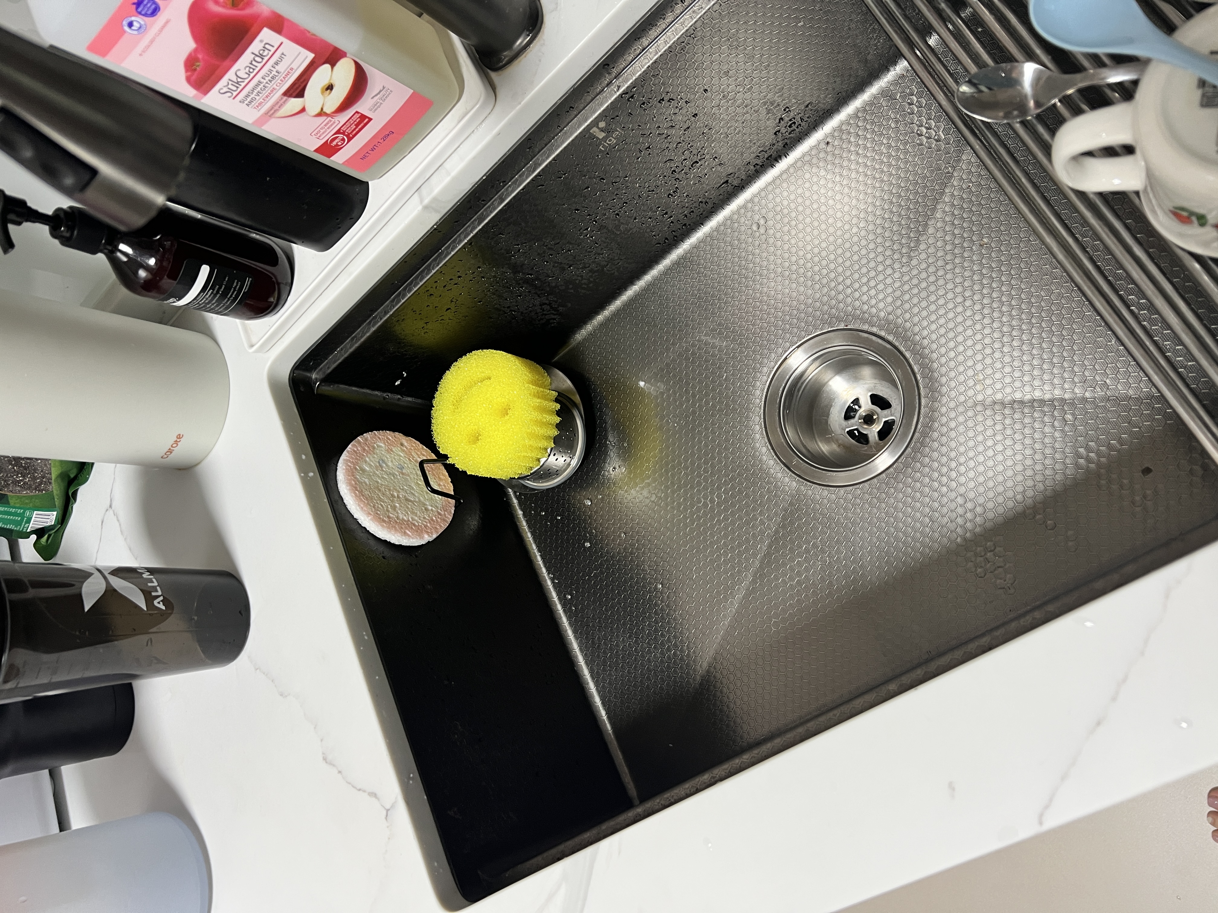 Our cozy little space - featuring our kitchen sink, hod and hood