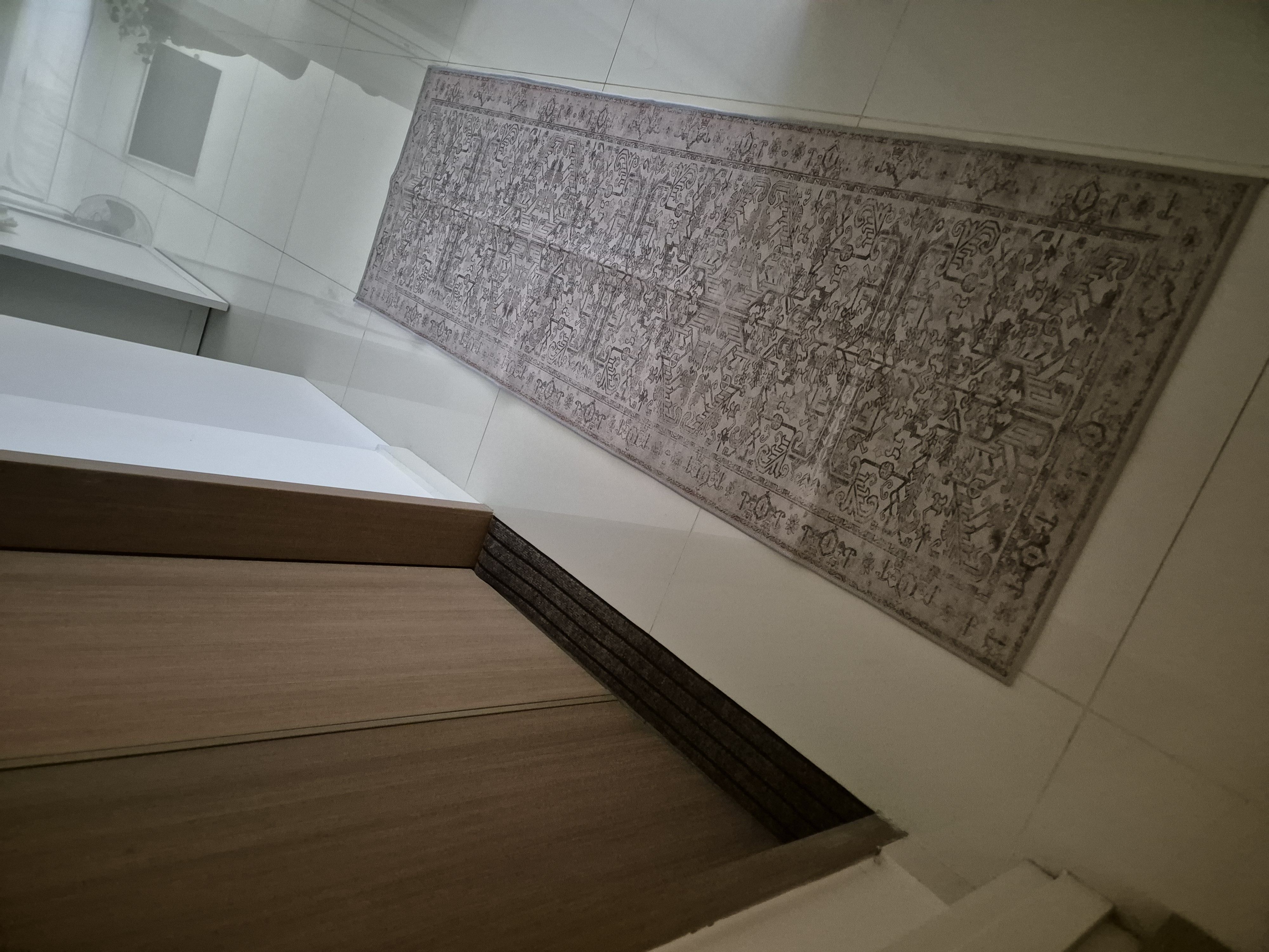 We removed the typical bathmat & replaced it with something minimal!