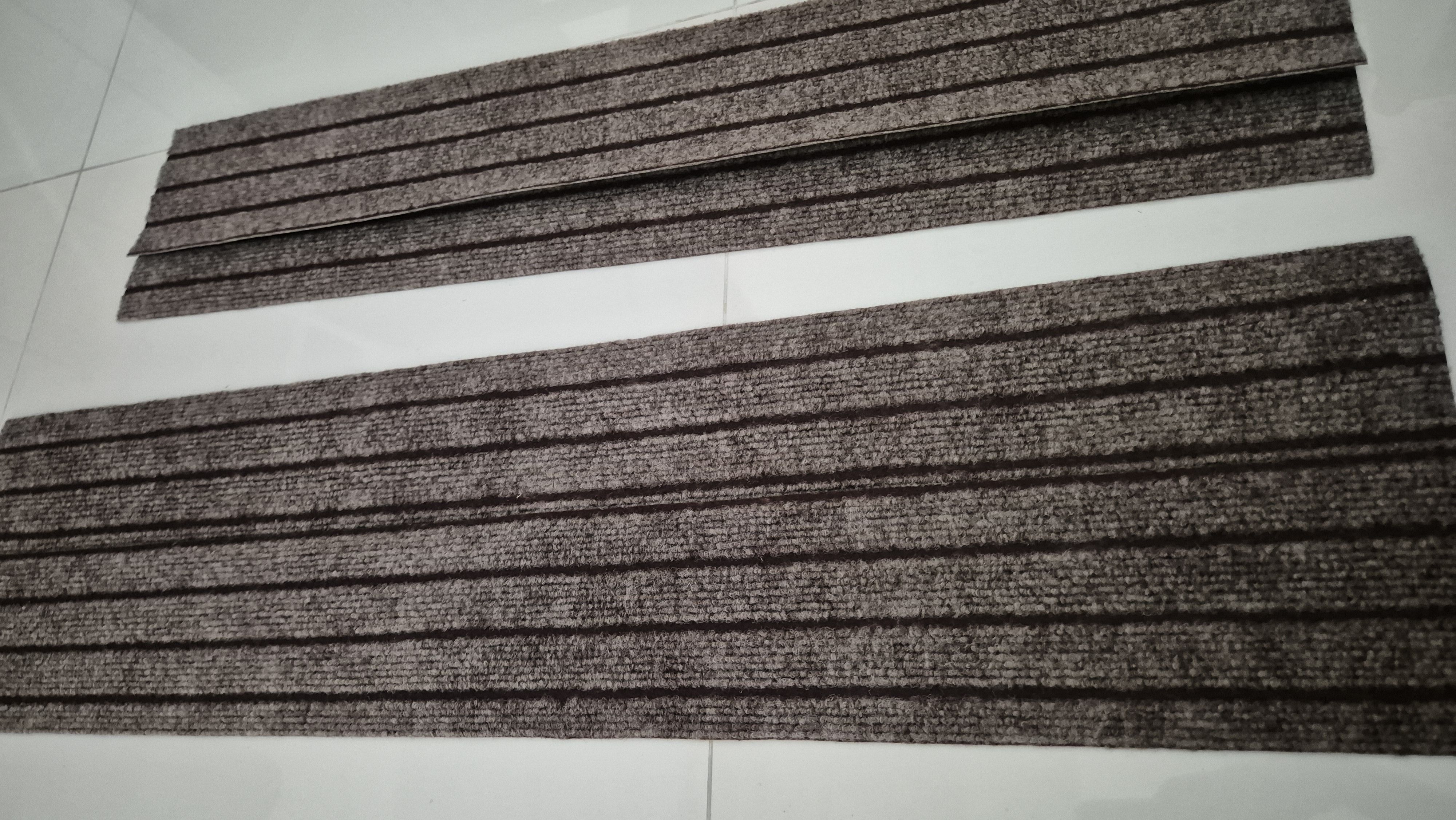 We removed the typical bathmat & replaced it with something minimal!