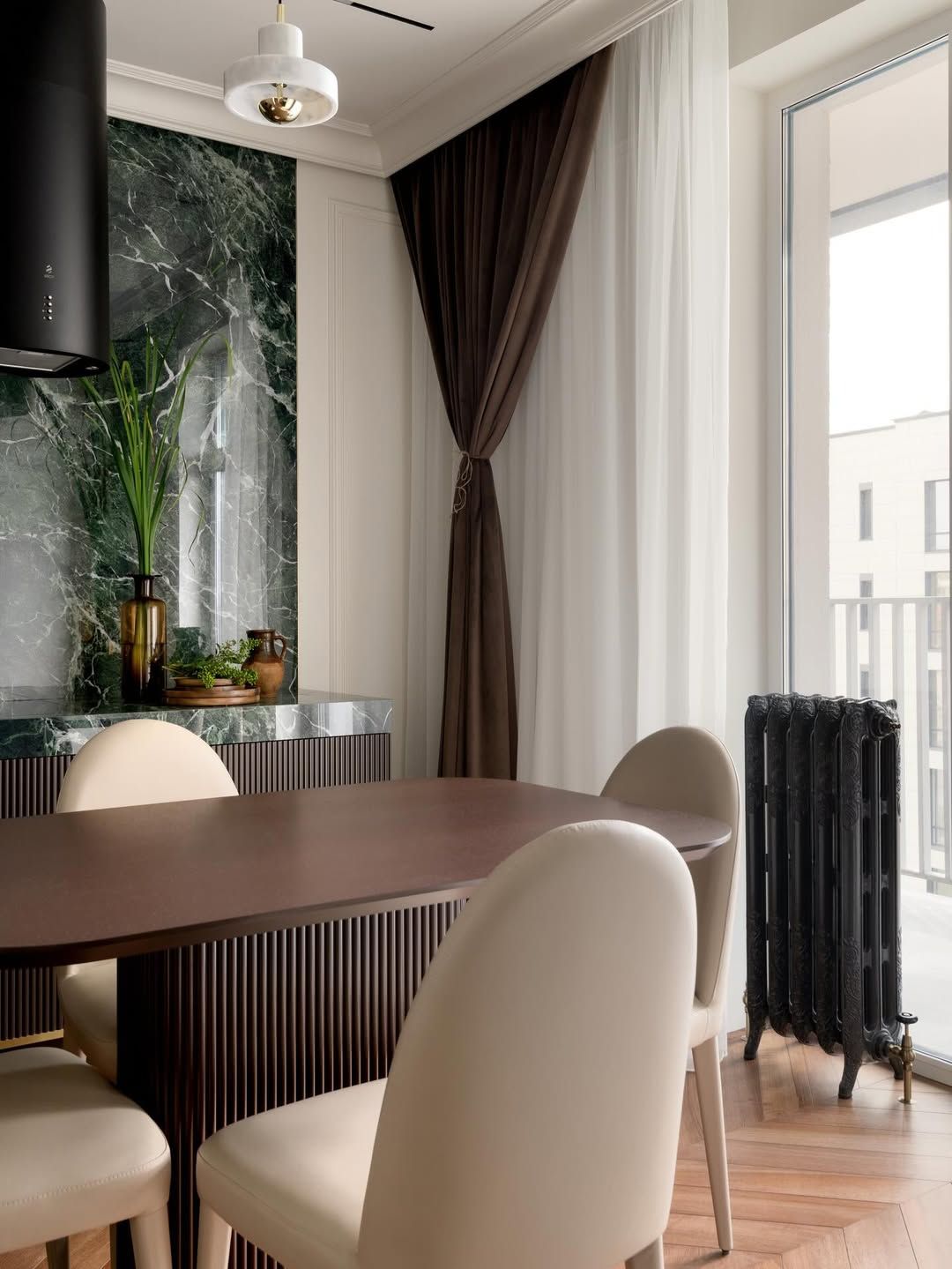 Luxe dining room with marble niche