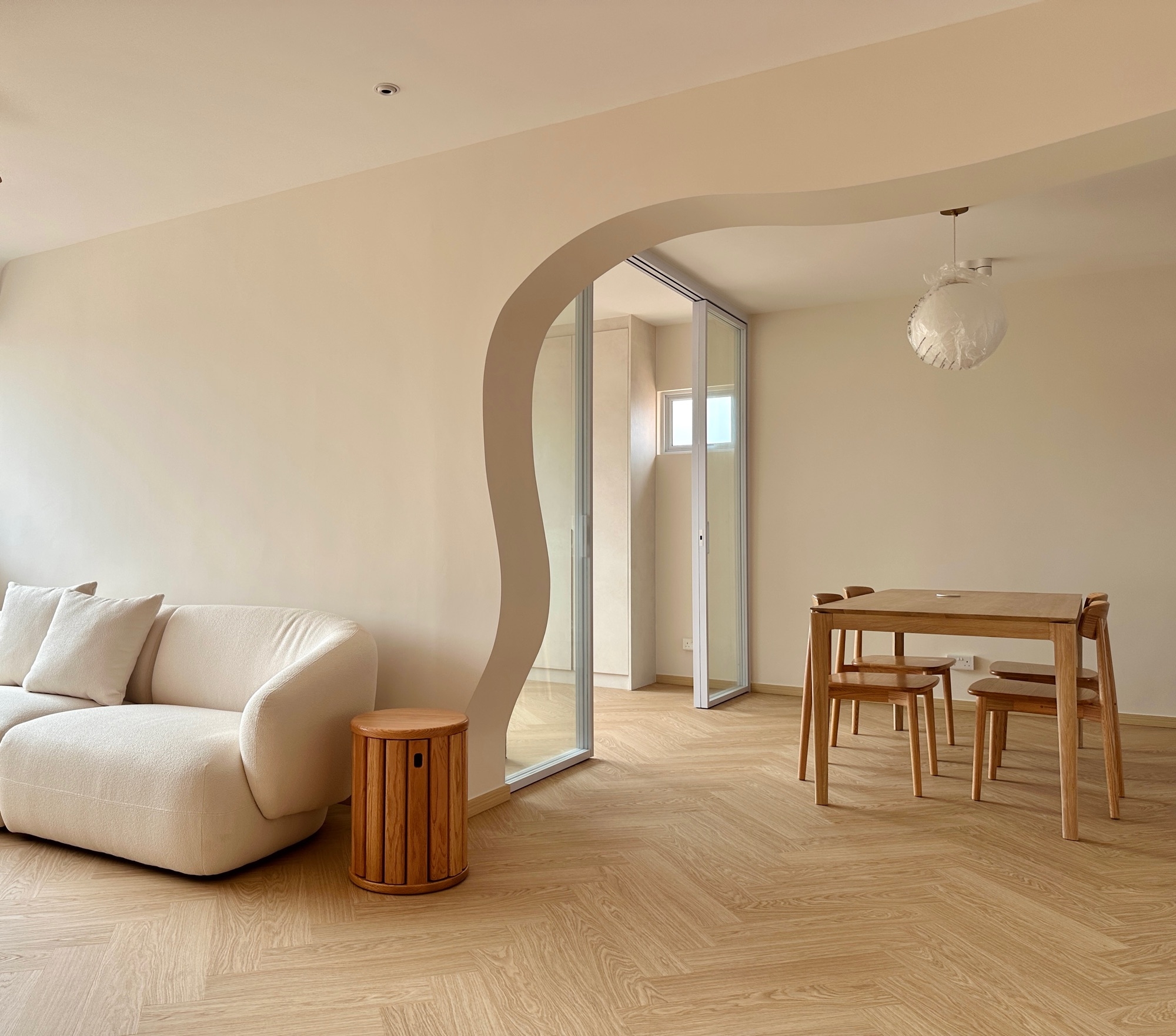 A peek into our living corner, framed with gentle curves