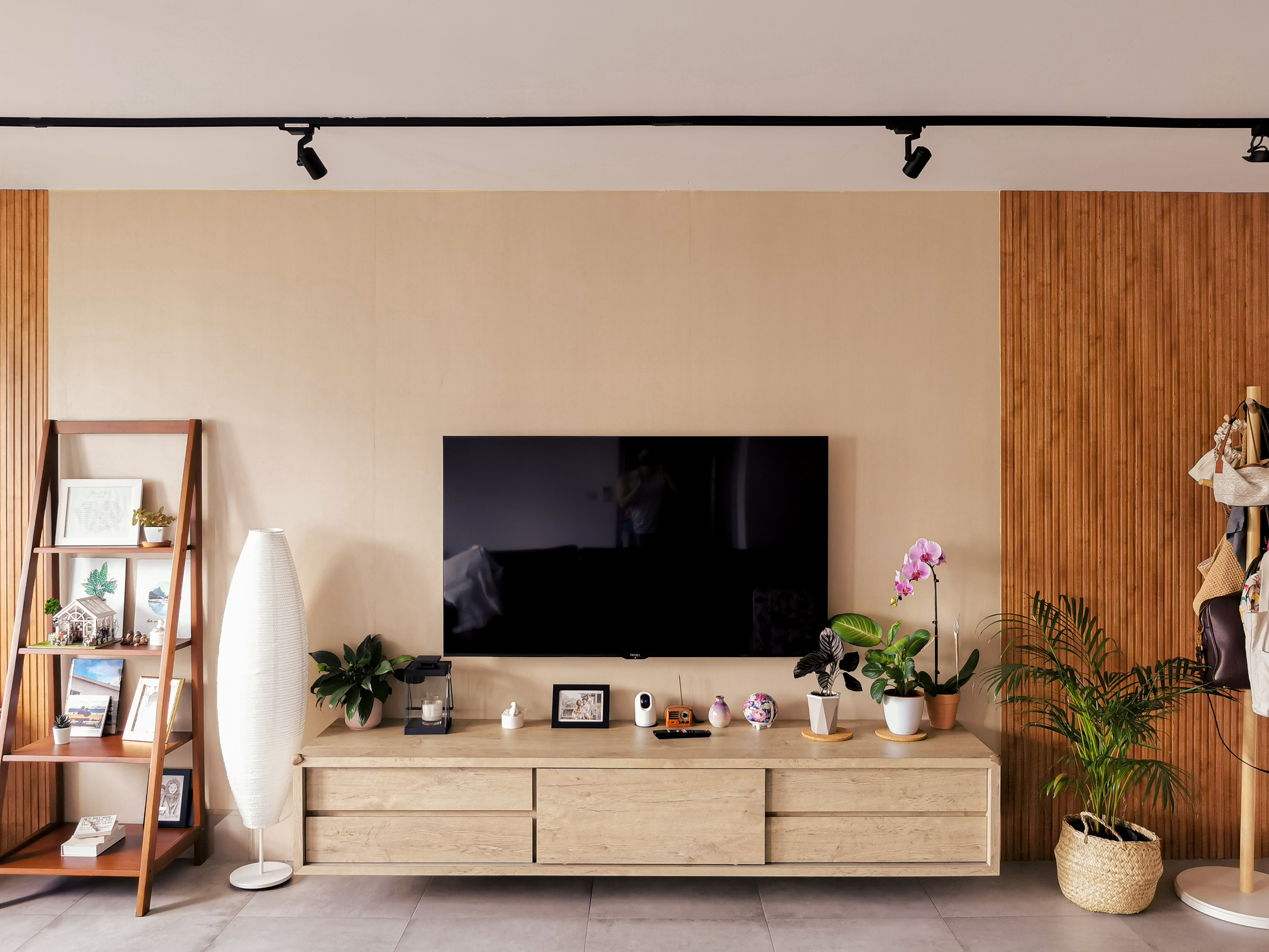 Rustic Retreat - Wooden shelf, framed pictures, potted plants, white lamp, beige wall, modern decor, minimalist design, cozy