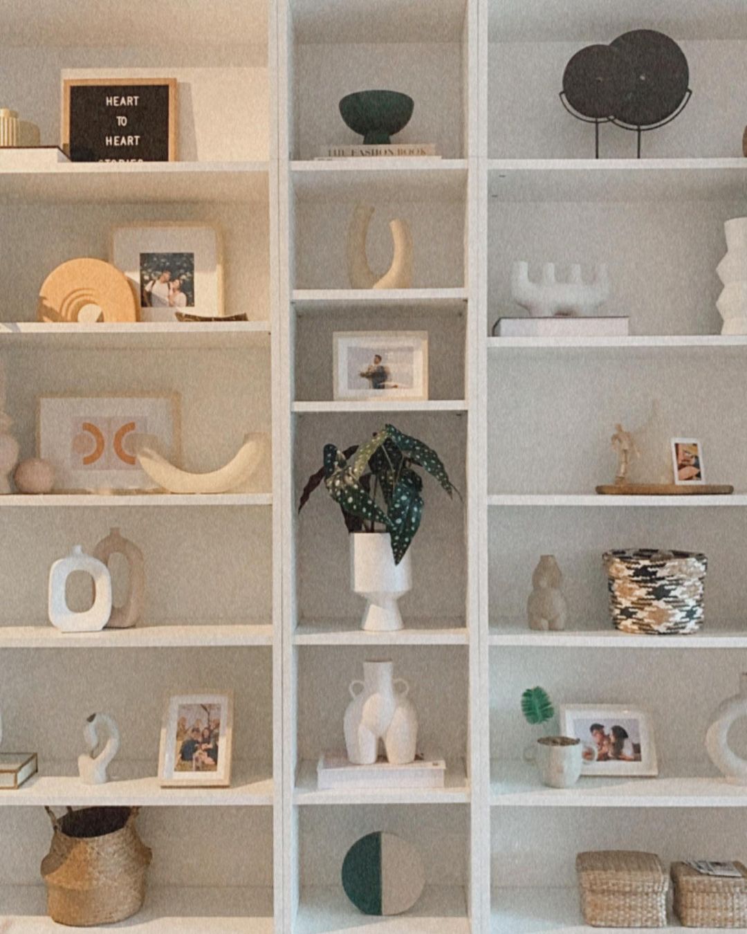 Urban oasis purr-fect for our cat! - Organized shelves, minimalist decor, neutral tones, geometric patterns, soft lighting