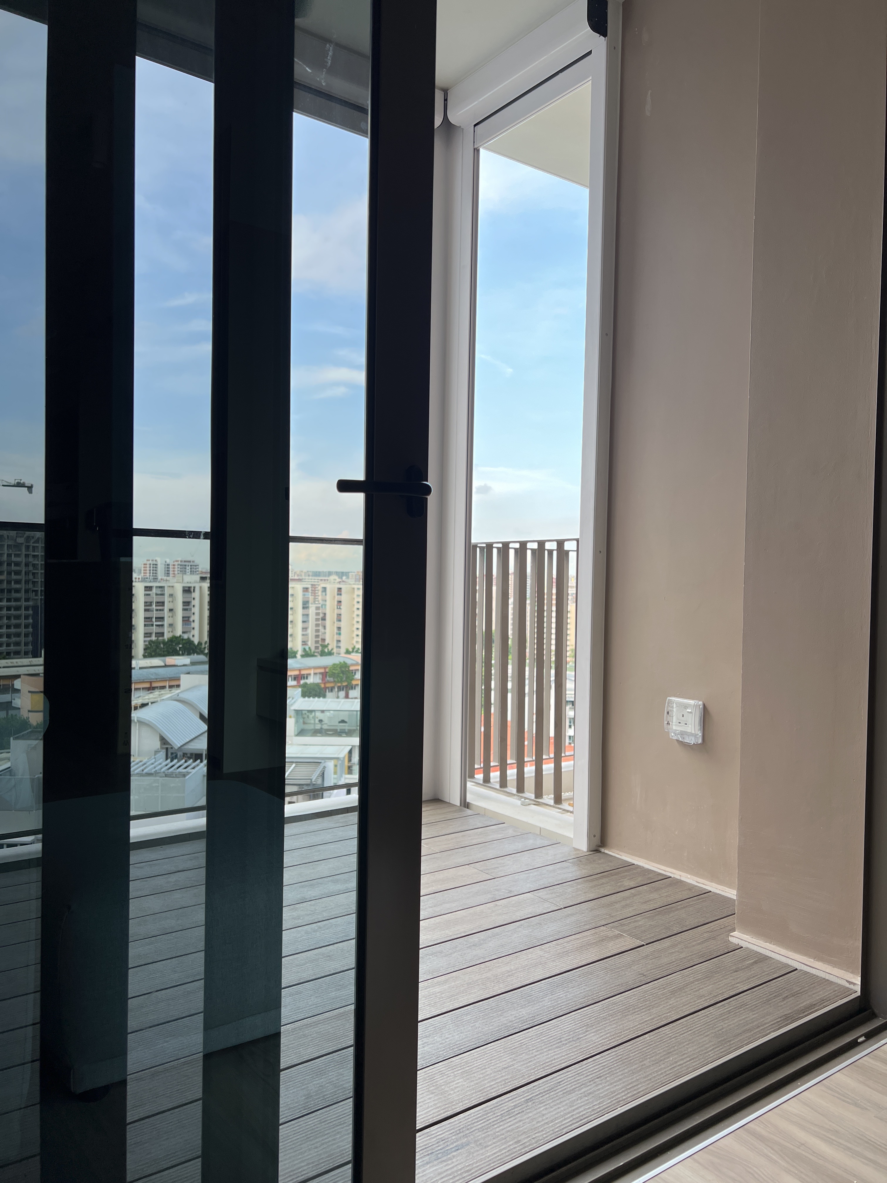 Inside My Scandi-Minimalist 1 Bedder Resale Condominium - Modern balcony with glass doors, urban cityscape view, large