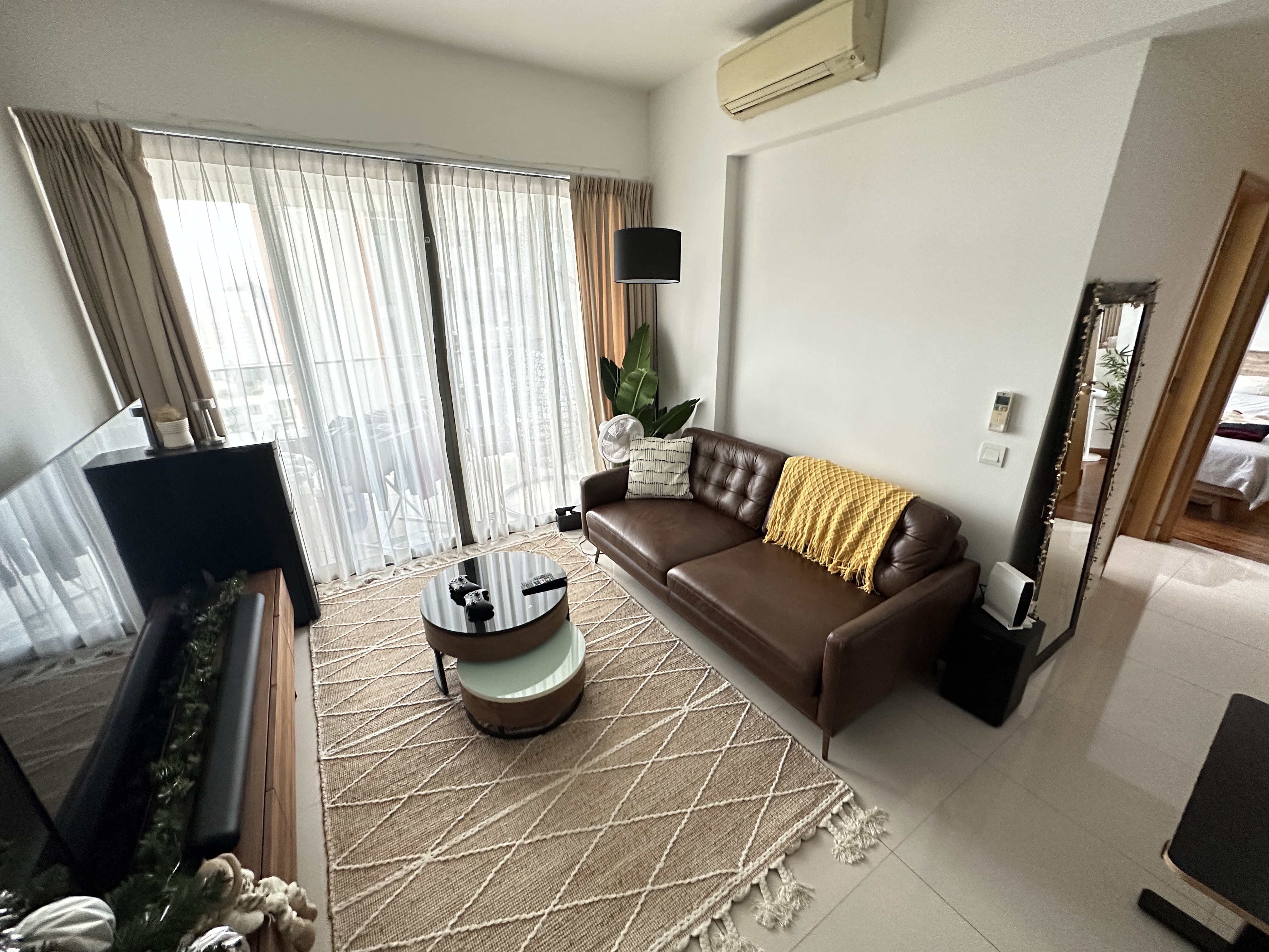 Welcome To Our Mid-Century Modern Condominium - Modern living room with large windows, beige curtains, brown leather sofa