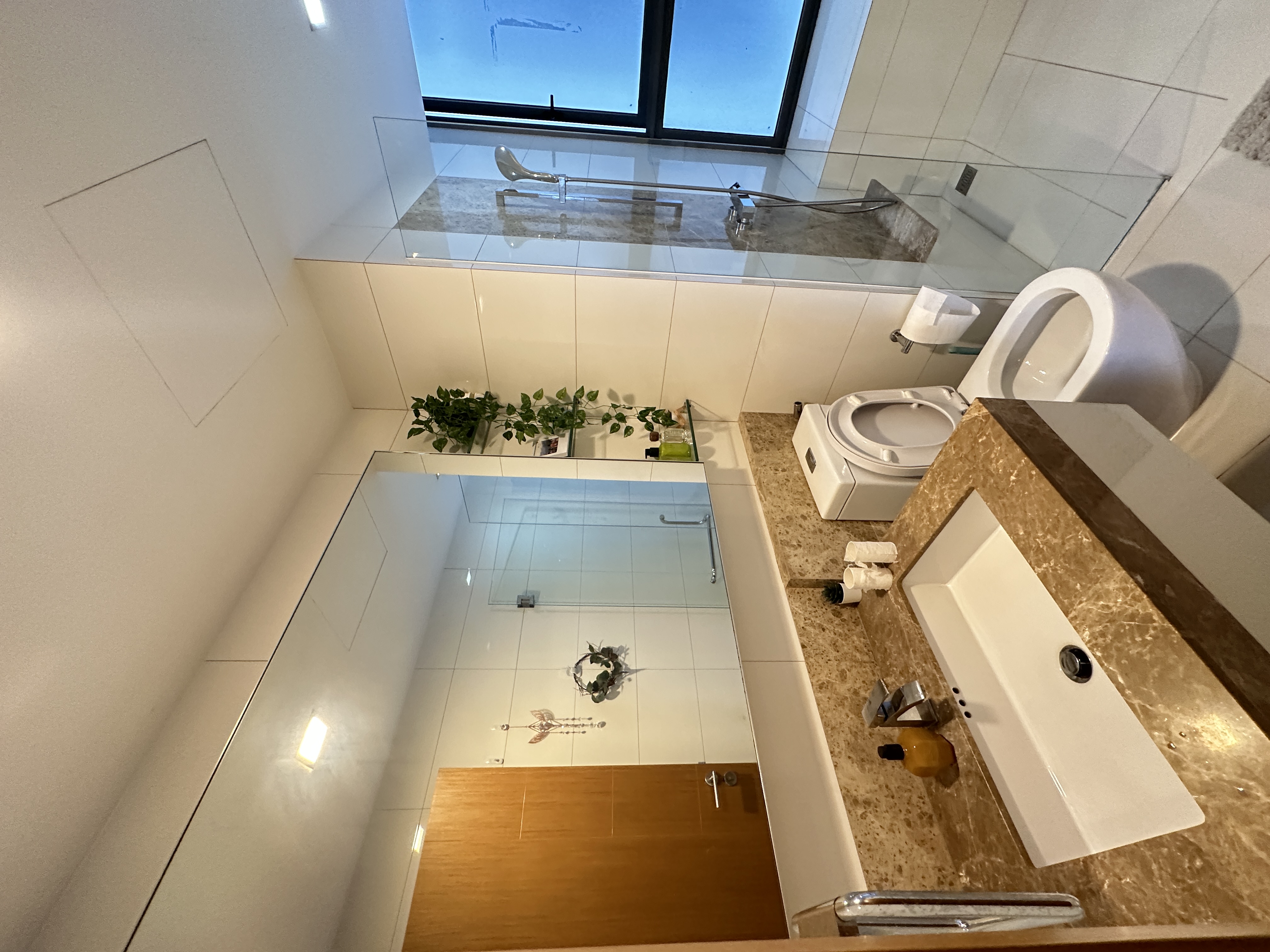 Welcome To Our Mid-Century Modern Condominium - Modern bathroom interior, minimalist design, large window, glass shower