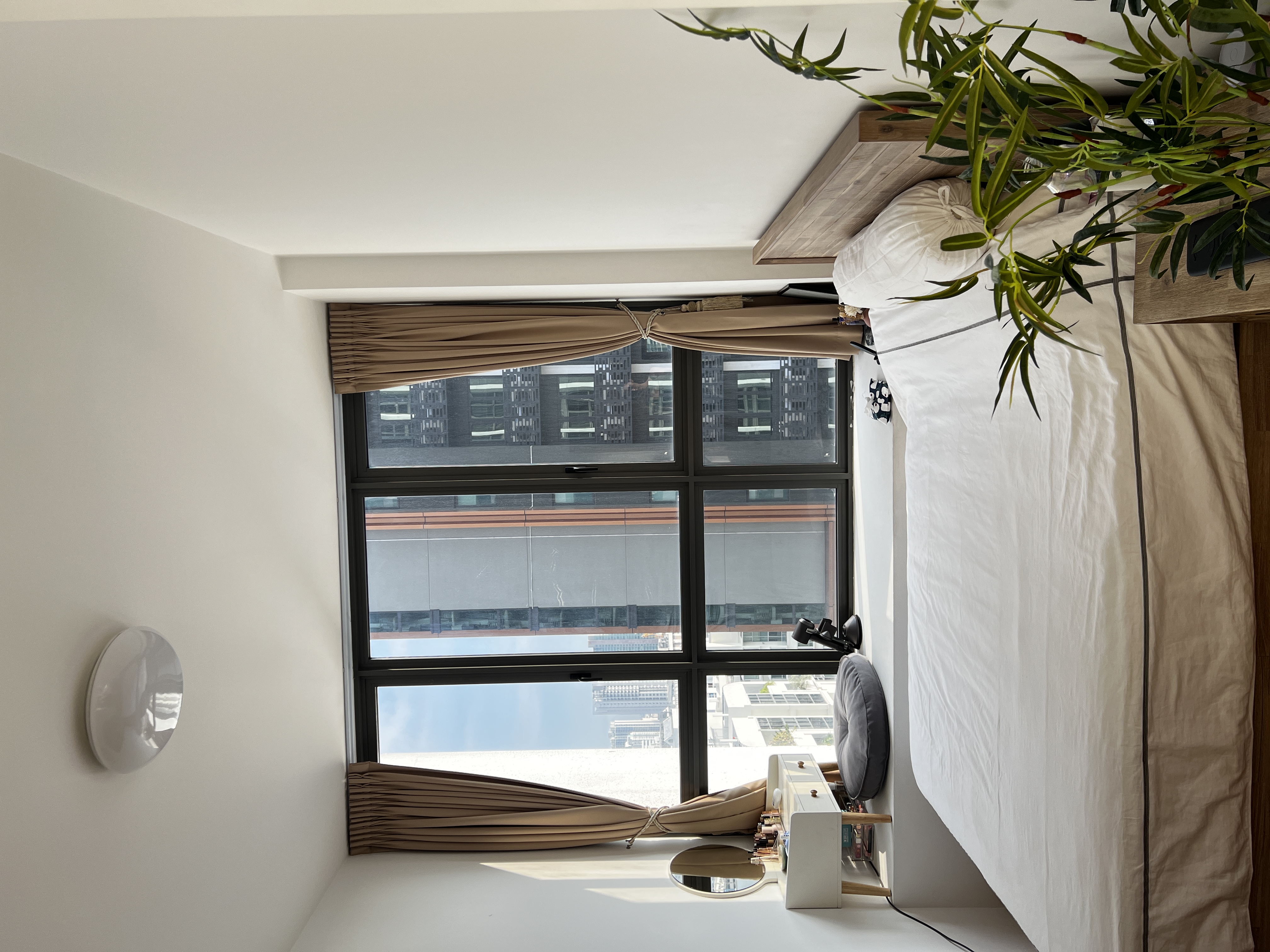 Welcome To Our Mid-Century Modern Condominium - Modern minimalist bedroom, large window, beige curtains, urban cityscape