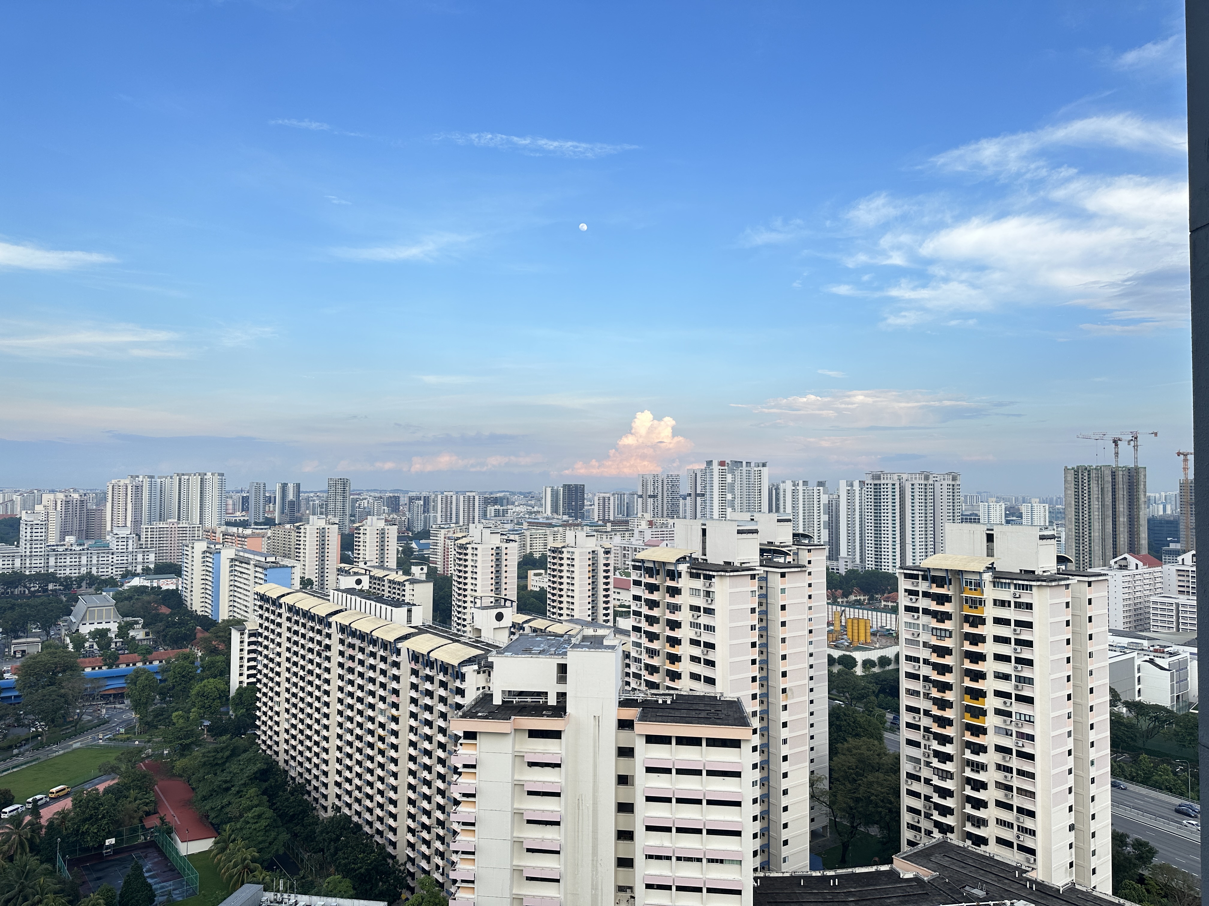 Welcome To Our Mid-Century Modern Condominium - Towering high-rise buildings in a bustling cityscape, Clear blue sky with a
