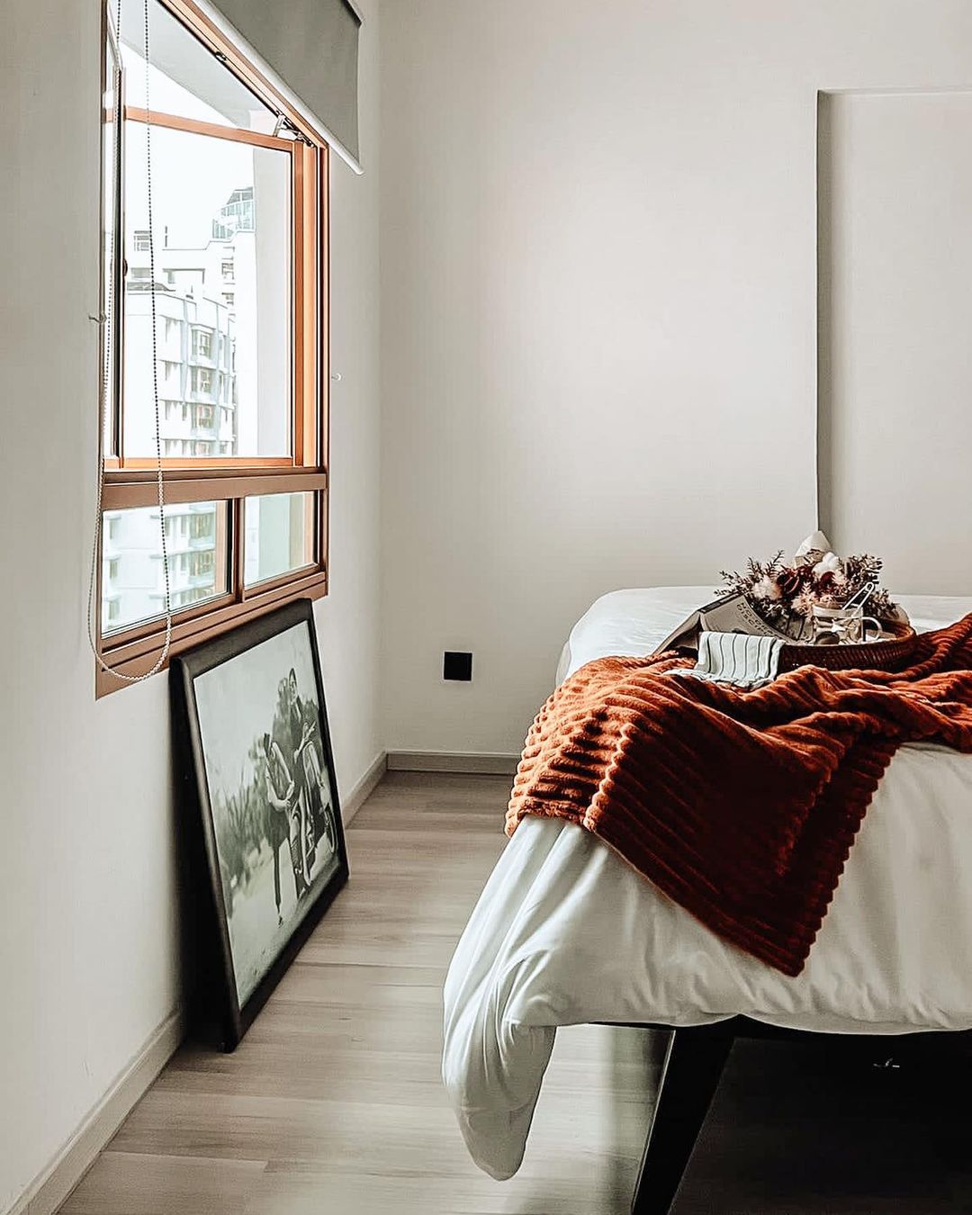 Playful Pink or Neutral Kids Room? - Modern minimalist bedroom, large window with wooden frame, white walls, light wooden