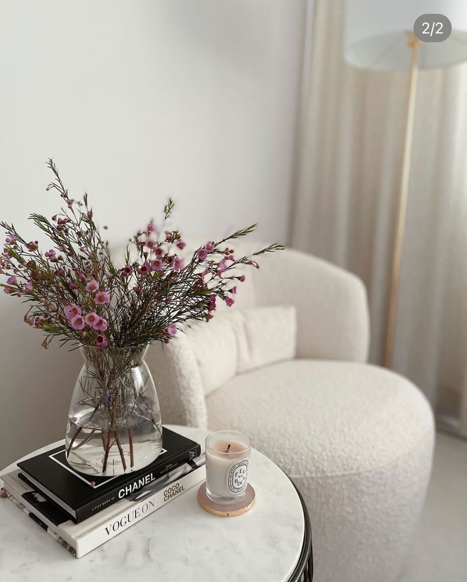 Elegance in Our Simple Cosy Corner - vase with flowers, candle, books, minimalist decor, soft lighting, cozy room, elegant