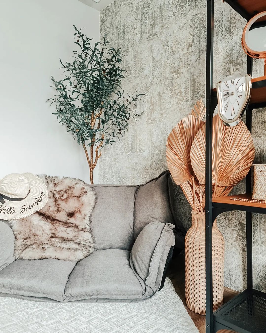 Urban Jungle Chic Cosy Corner! - gray sofa, beige fur throw, black metal shelf, vintage clock, white hat, textured wallpaper