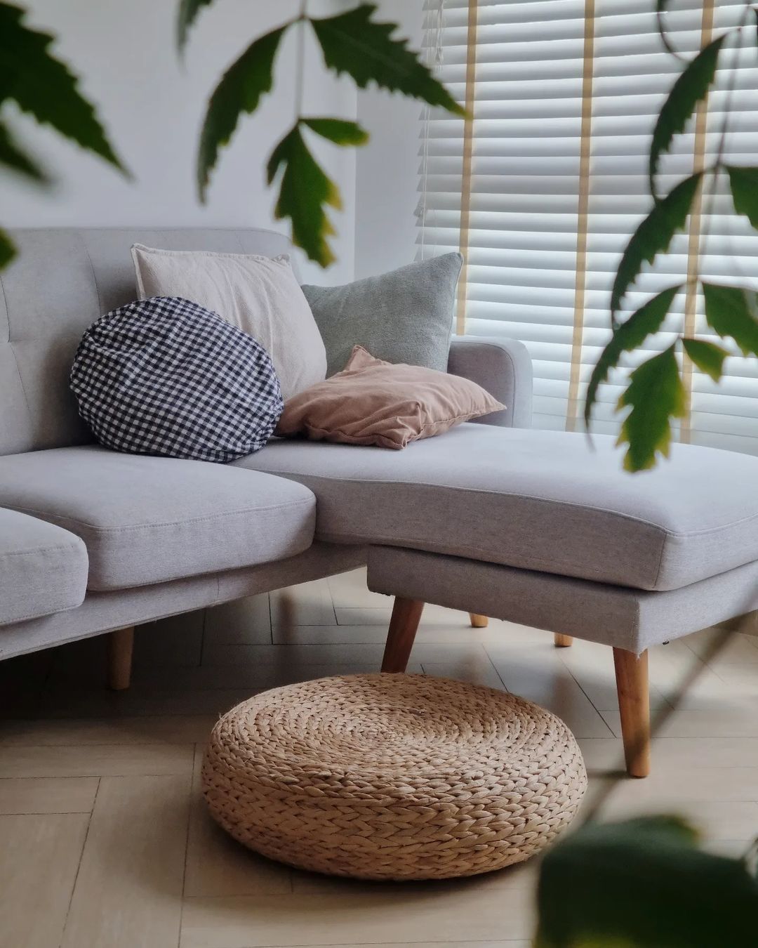 Scandinavian Serenity - Light gray sofa, wooden legs, light wooden floor, cozy living room, modern decor, soft natural light