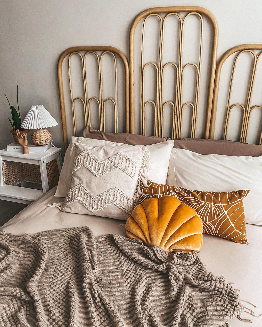 Absolute joy waking up to our Scandinavian bedroom - Cream and beige throw pillows, white and brown textured blanket, rustic