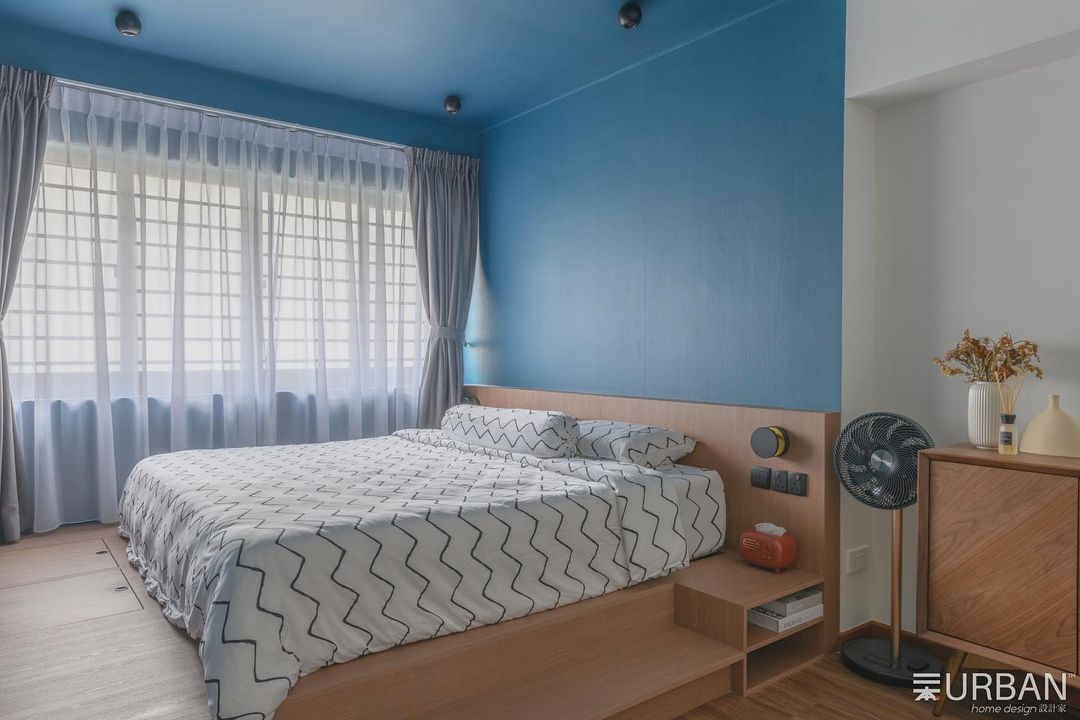 Blue Bliss Bedroom - Blue painted walls, modern bedroom, wooden furniture, white and black zigzag bedspread, large window