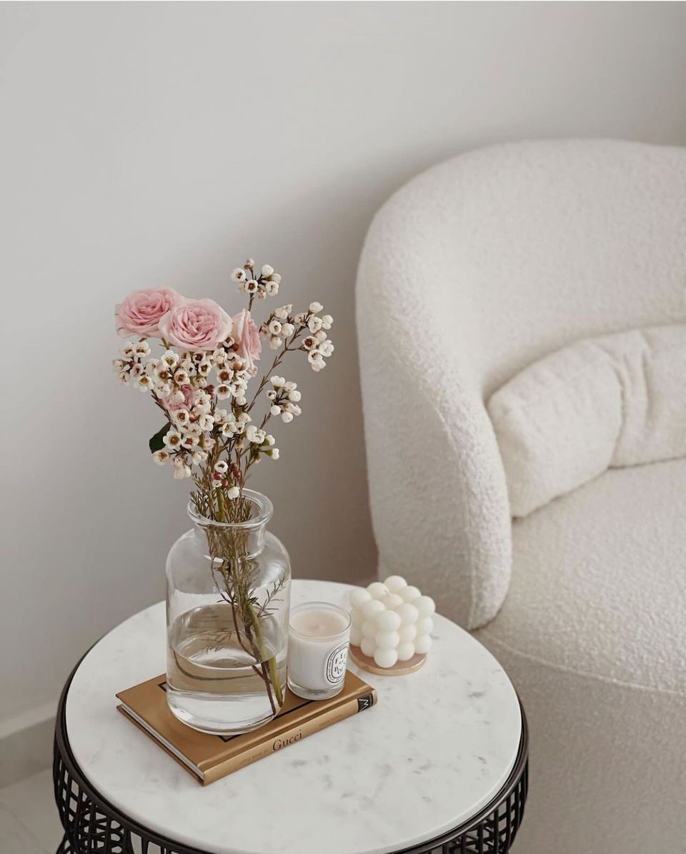 Elegance in Our Simple Cosy Corner - vase with flowers, pink roses, white flowers, clear glass vase, small candle, white