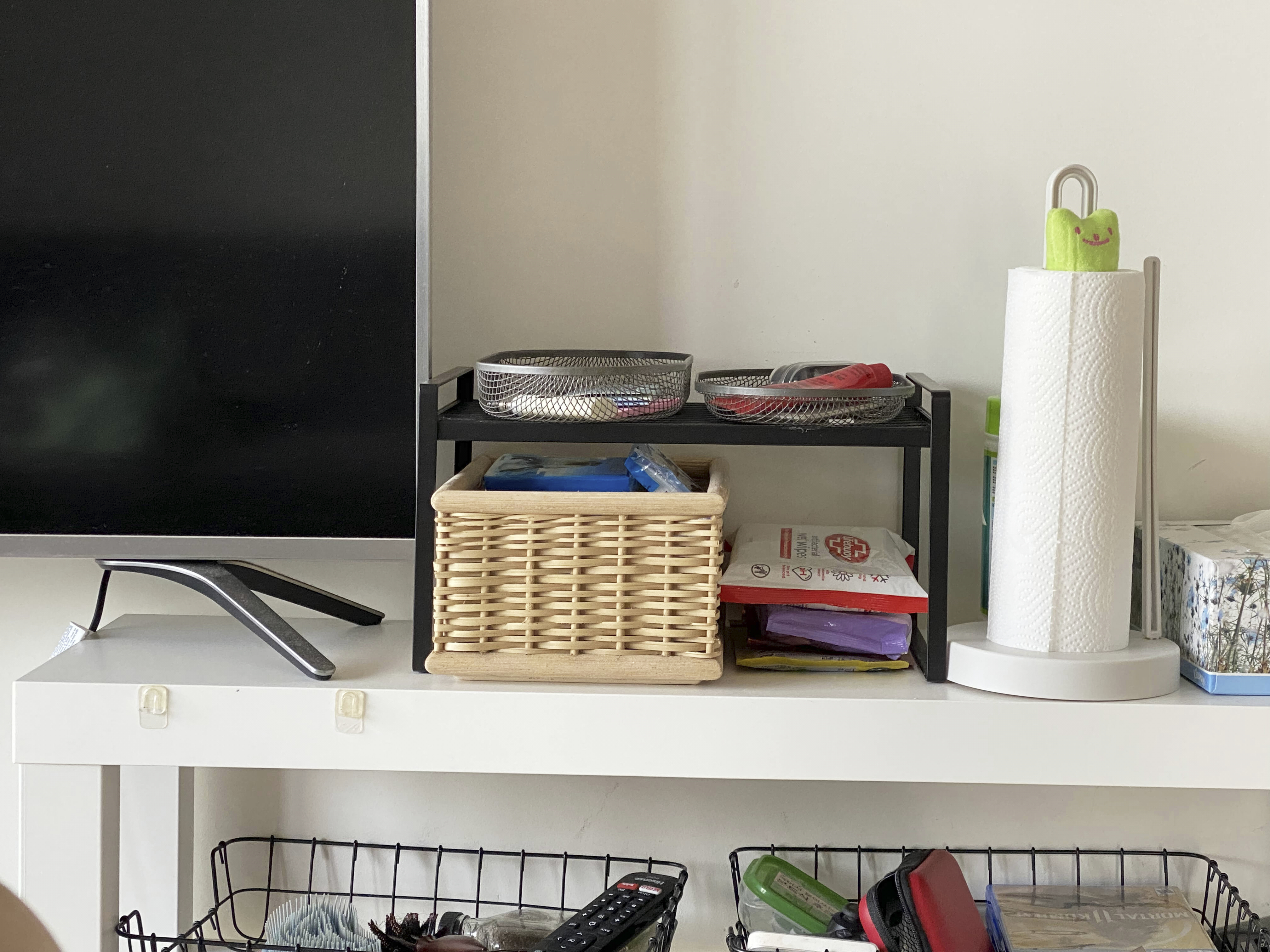 A Photographer's One-Room Studio Man Cave - wire basket, black shelf, white wall, black monitor, white drawer, wicker basket