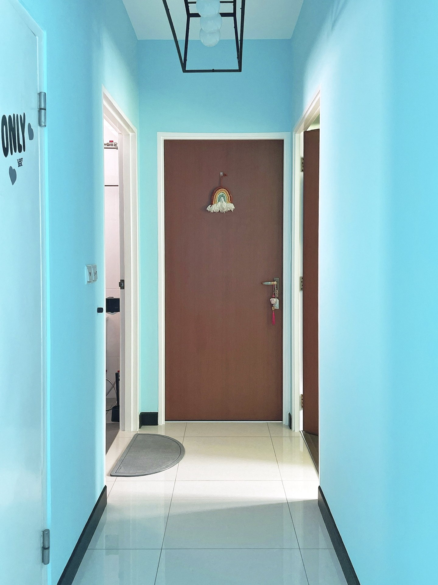 Our Colourful Personalities Imprinted On Our Apartment - Light blue walls, minimalist design, white trim, modern lighting