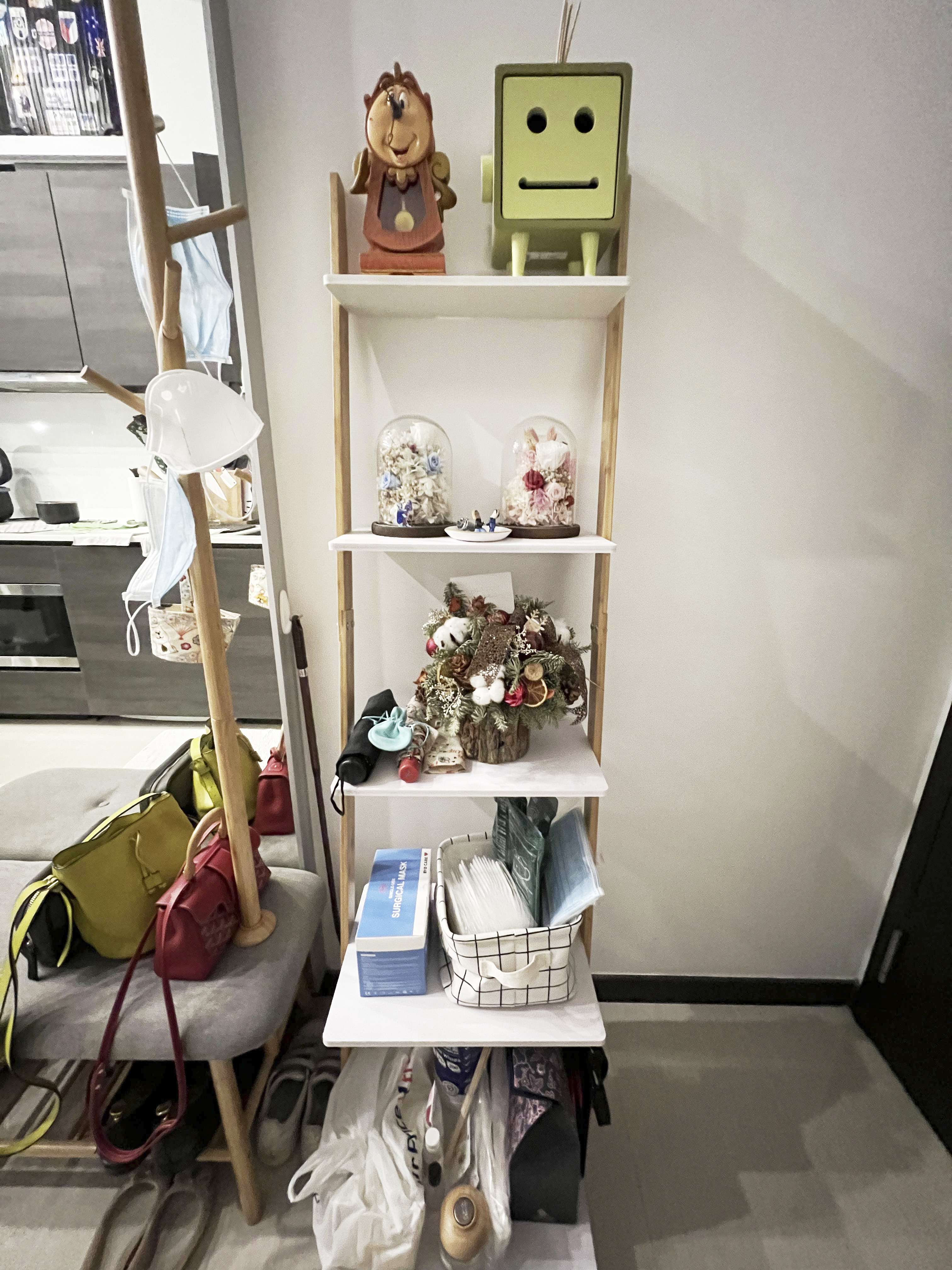 Our Smart Apartment That Might Be Smarter Than Us - Shelves, decorative items, wooden stand, small figurine, green robot