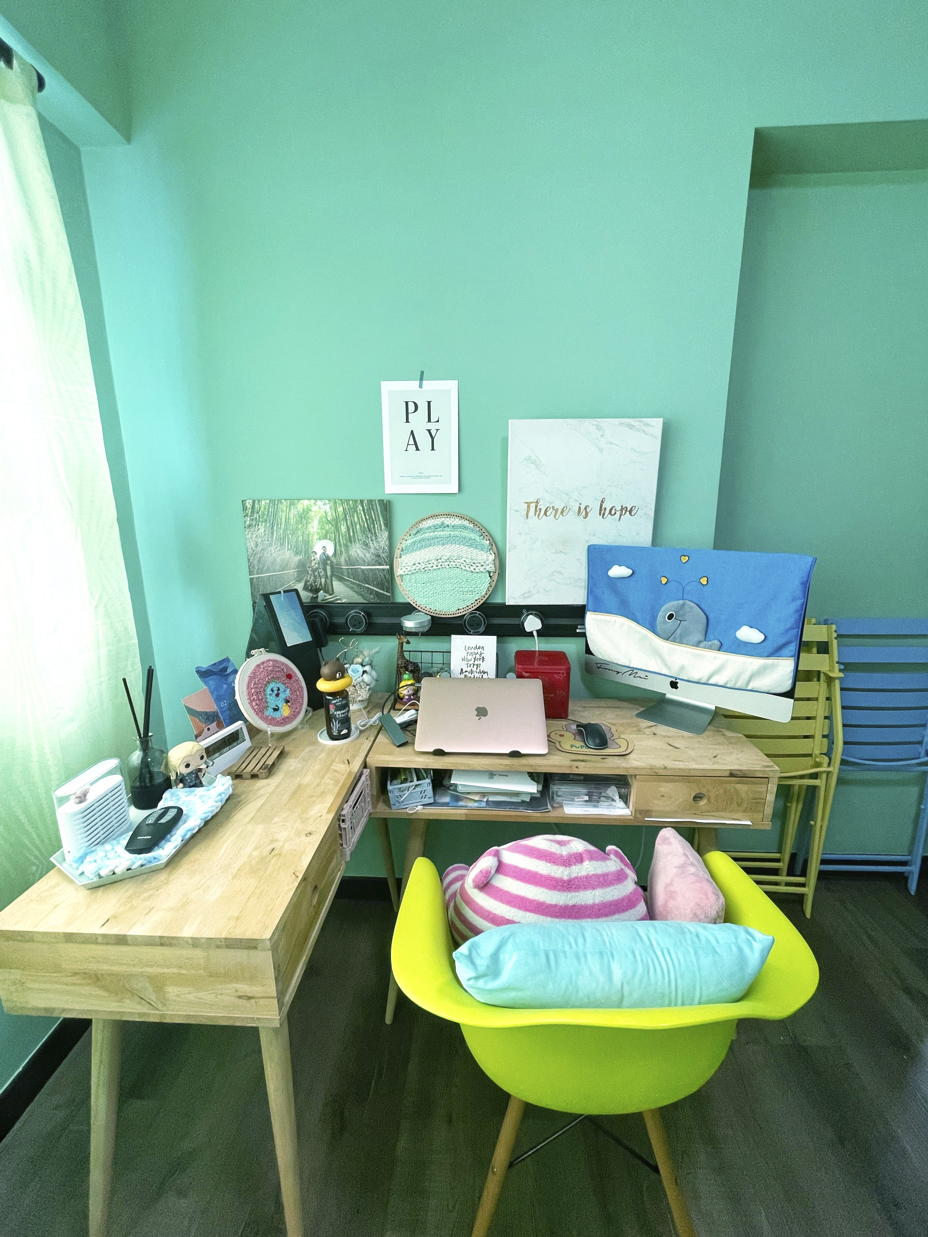 Our Colourful Personalities Imprinted On Our Apartment - Wooden desk, light green walls, modern workspace, colorful pillows