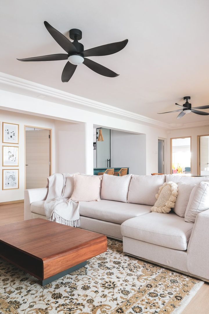 Clean aesthetics with a tinge of teal - Modern living room with beige sectional sofa, wooden coffee table, patterned area