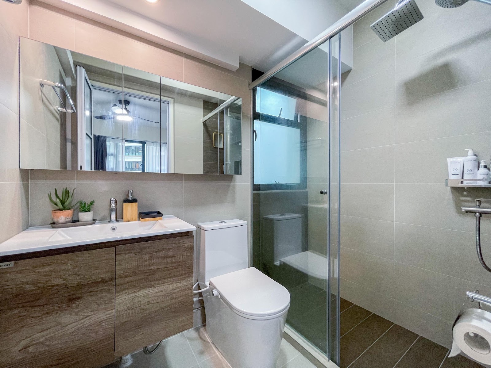 Modern Home for the Modern Interracial Couple - White bathroom vanity, wooden cabinets, modern design, large mirror, glass