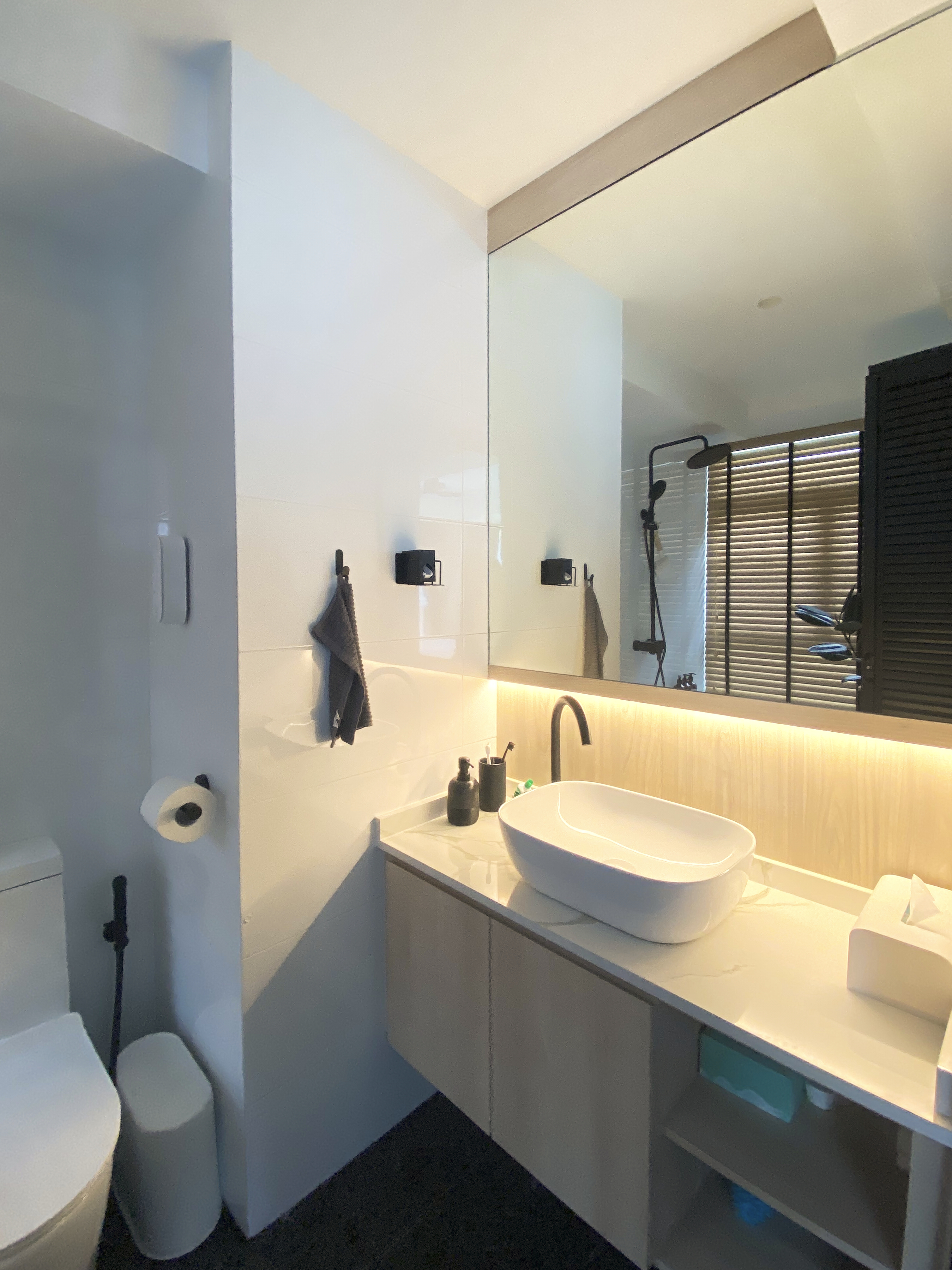A Minimalist Apartment with an Urban Jungle - Modern minimalist bathroom, sleek design, white color scheme, large mirror