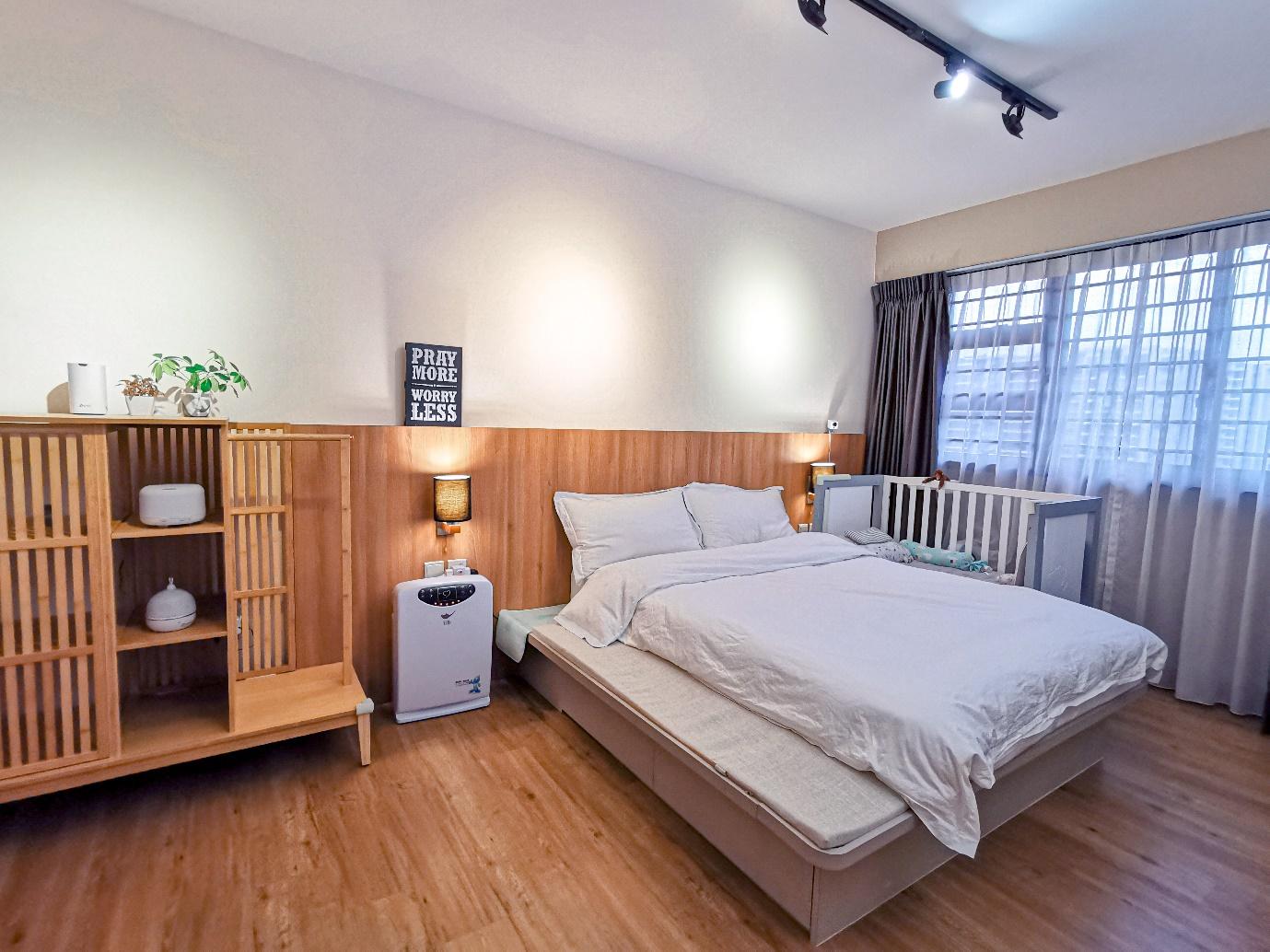 This is Home, Truly - Wooden nightstand, white air purifier, baby crib, bedside table, motivational sign, wooden shelving