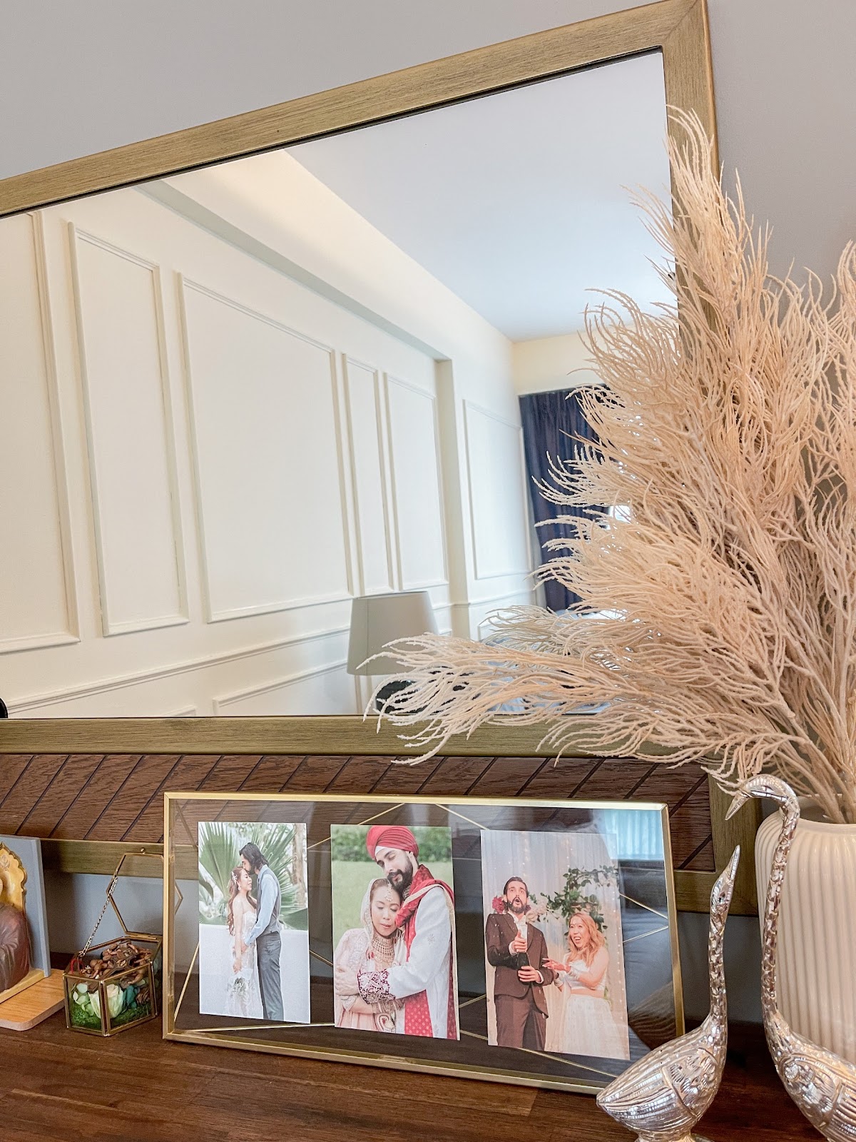 Modern Home for the Modern Interracial Couple - mirror, vanity, framed photos, wedding, couple, portrait, indoor, elegant