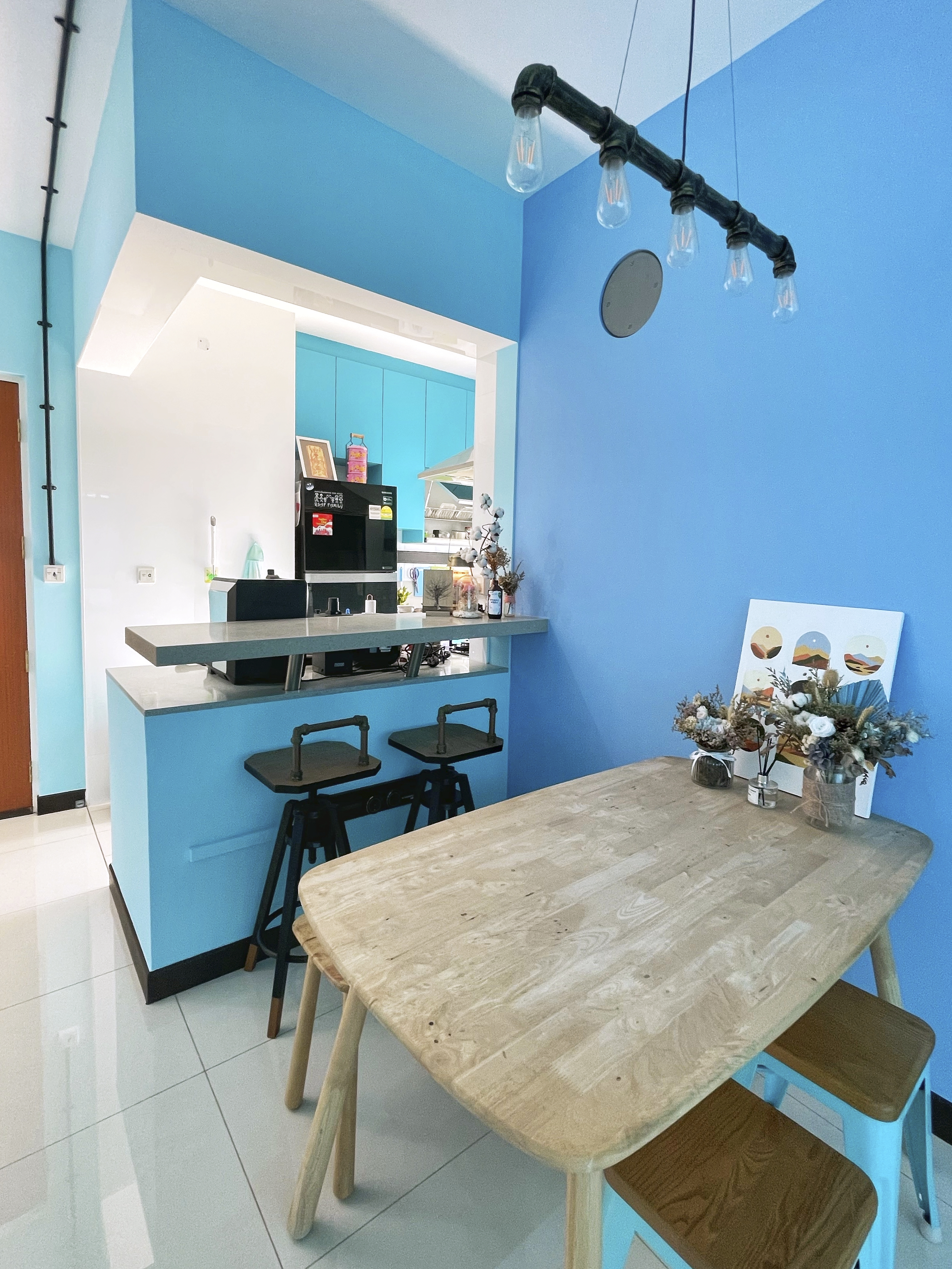 Our Colourful Personalities Imprinted On Our Apartment - Modern kitchen with blue walls, minimalist design, open-concept