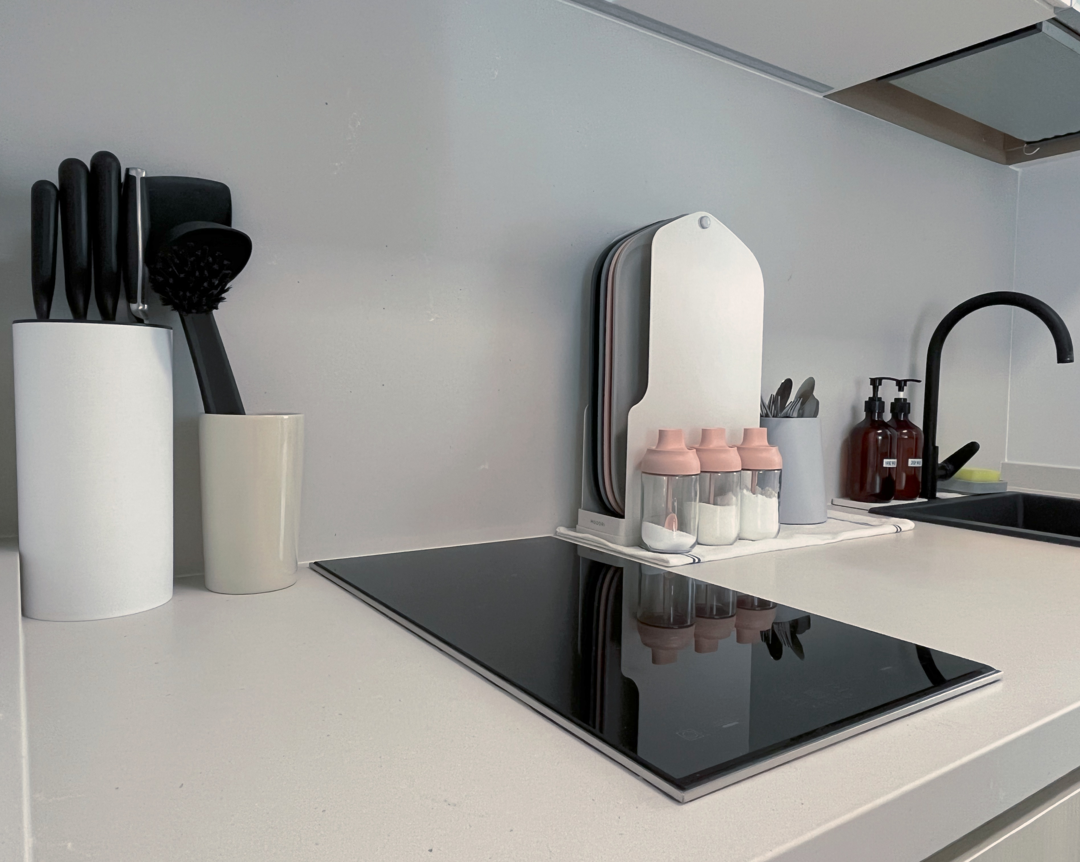 Living In A Cosy 3-room Flat with Minimal Housekeeping - White kitchen countertop, modern kitchen sink, black and white