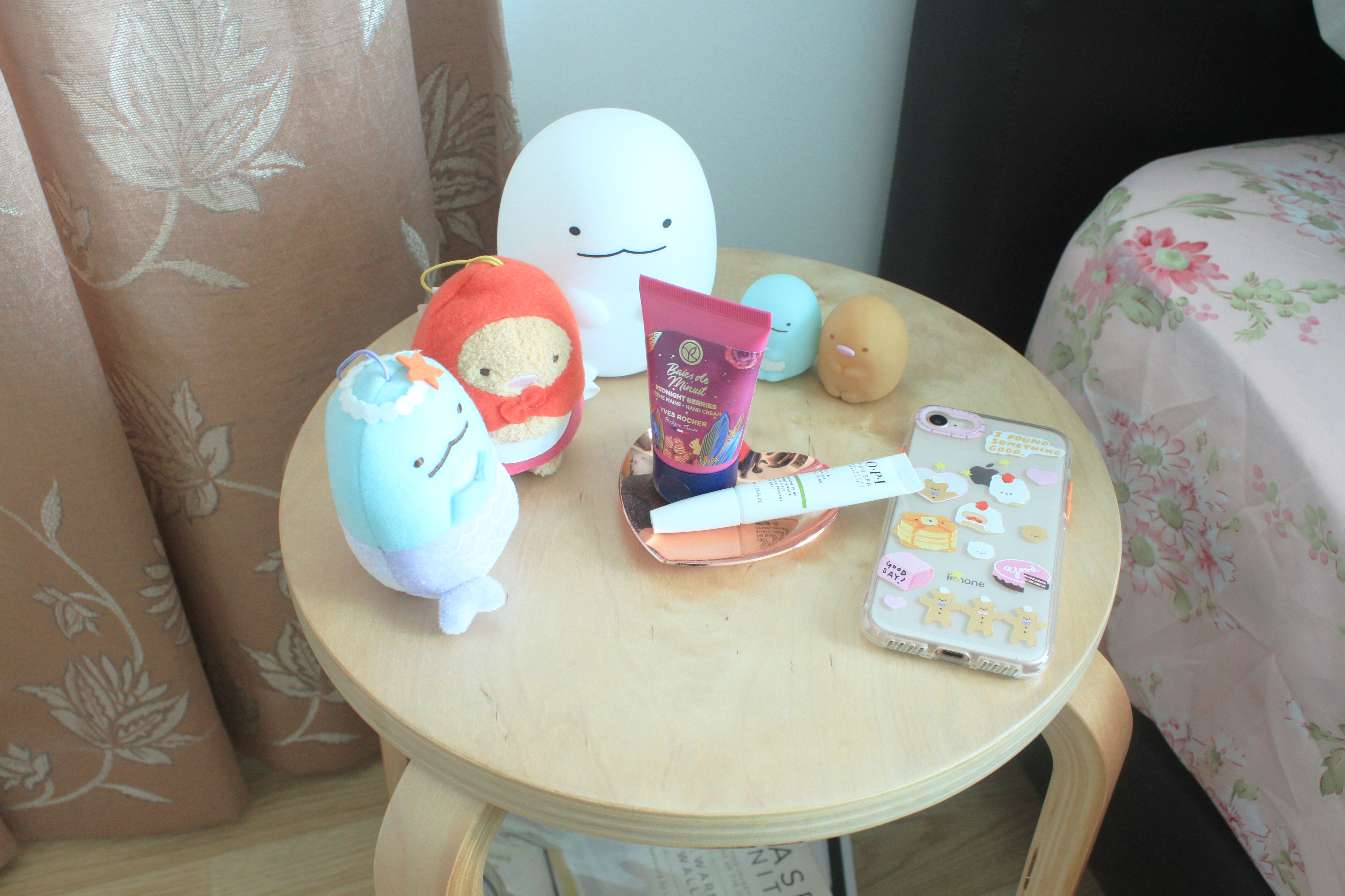 My Home Away From Home - Soft pastel balloons, plush toys, pink and blue items, floral-patterned curtains, wooden round