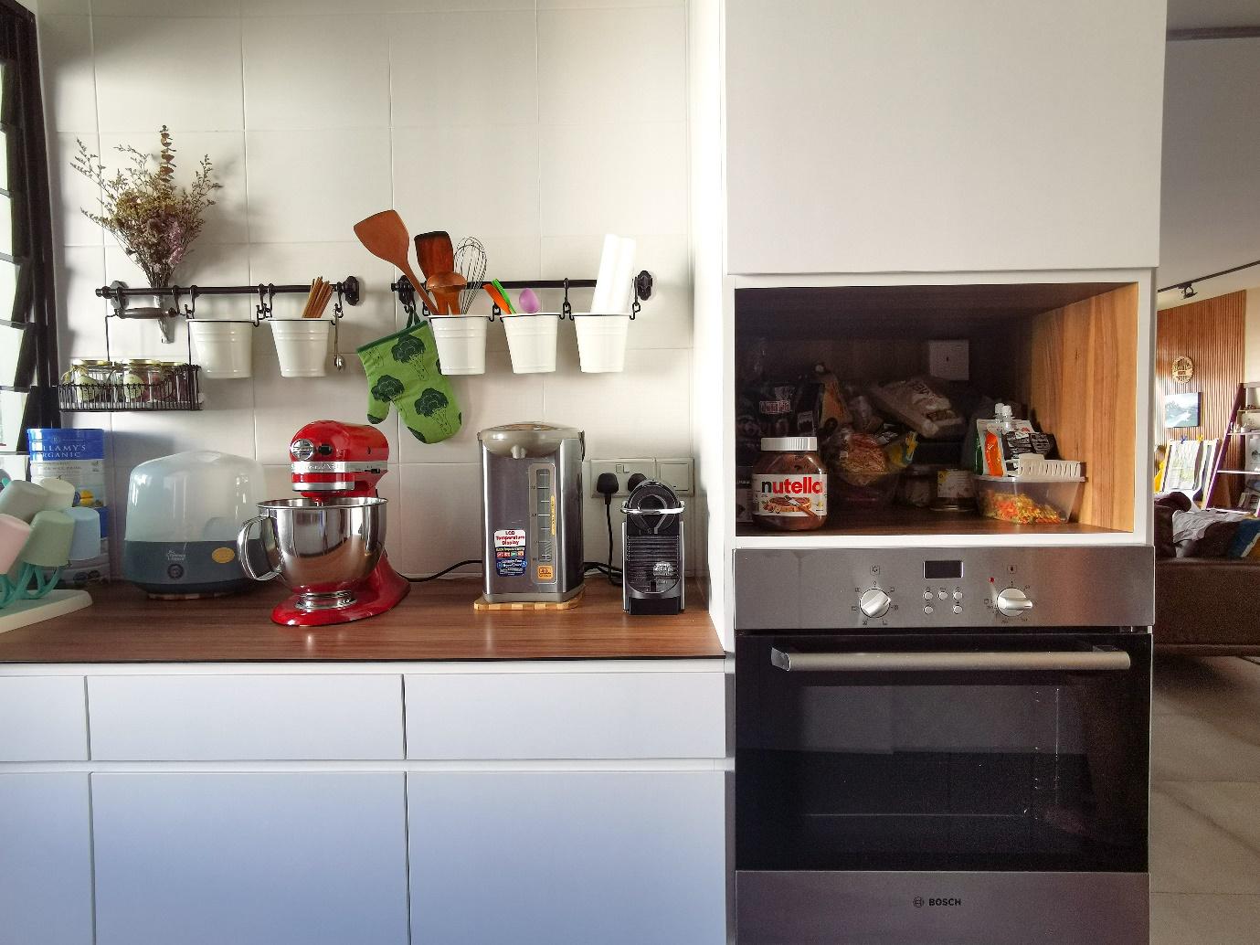 This is Home, Truly - Red stand mixer, white cup holder, wooden countertop, white cabinets, modern kitchen, stainless steel