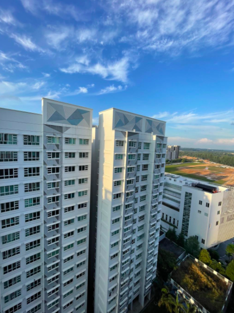 Our Colourful Personalities Imprinted On Our Apartment - Modern high-rise apartment buildings, clear blue sky, geometric