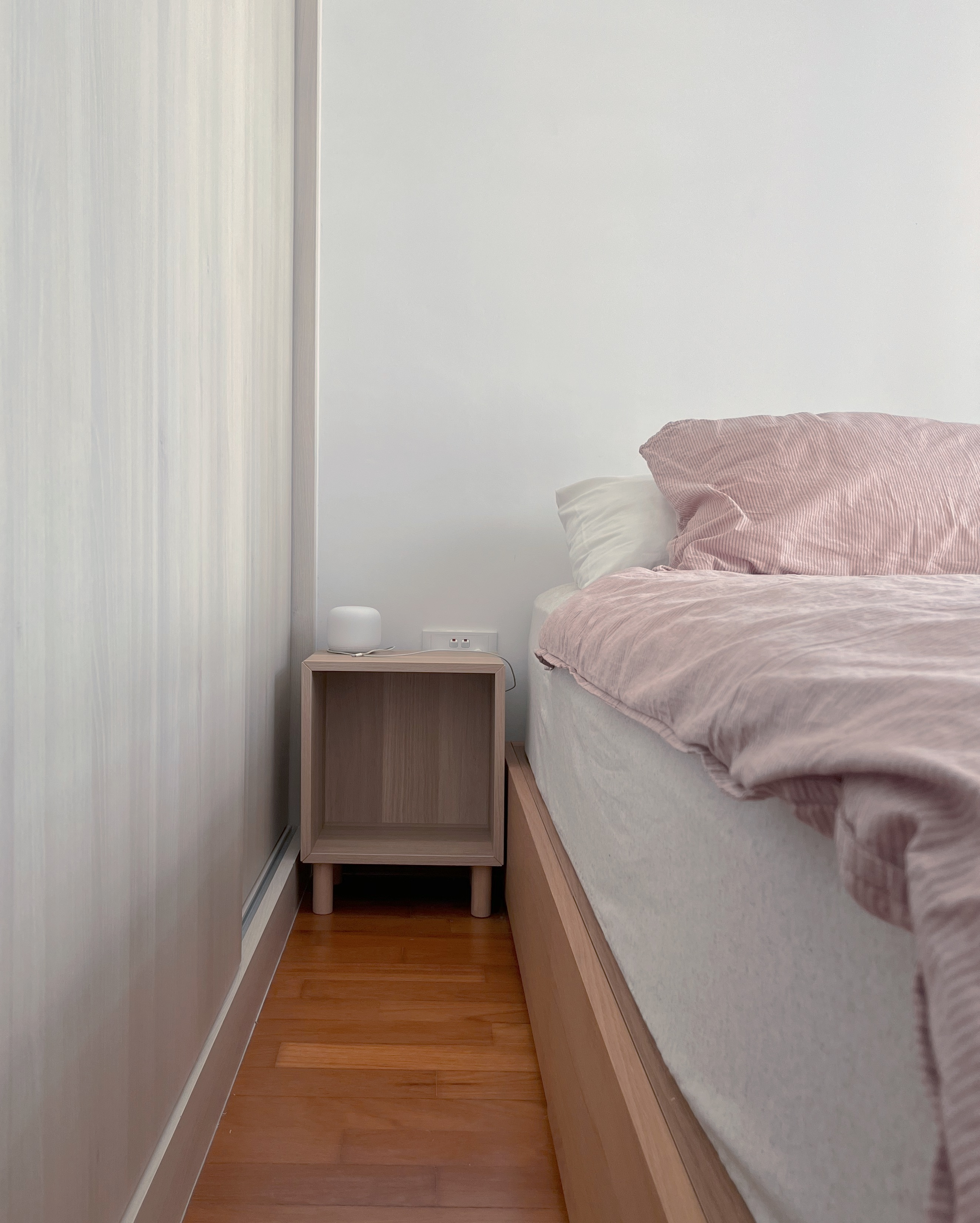 Living In A Cosy 3-room Flat with Minimal Housekeeping - Light-colored wooden nightstand, minimalist design, small bedside