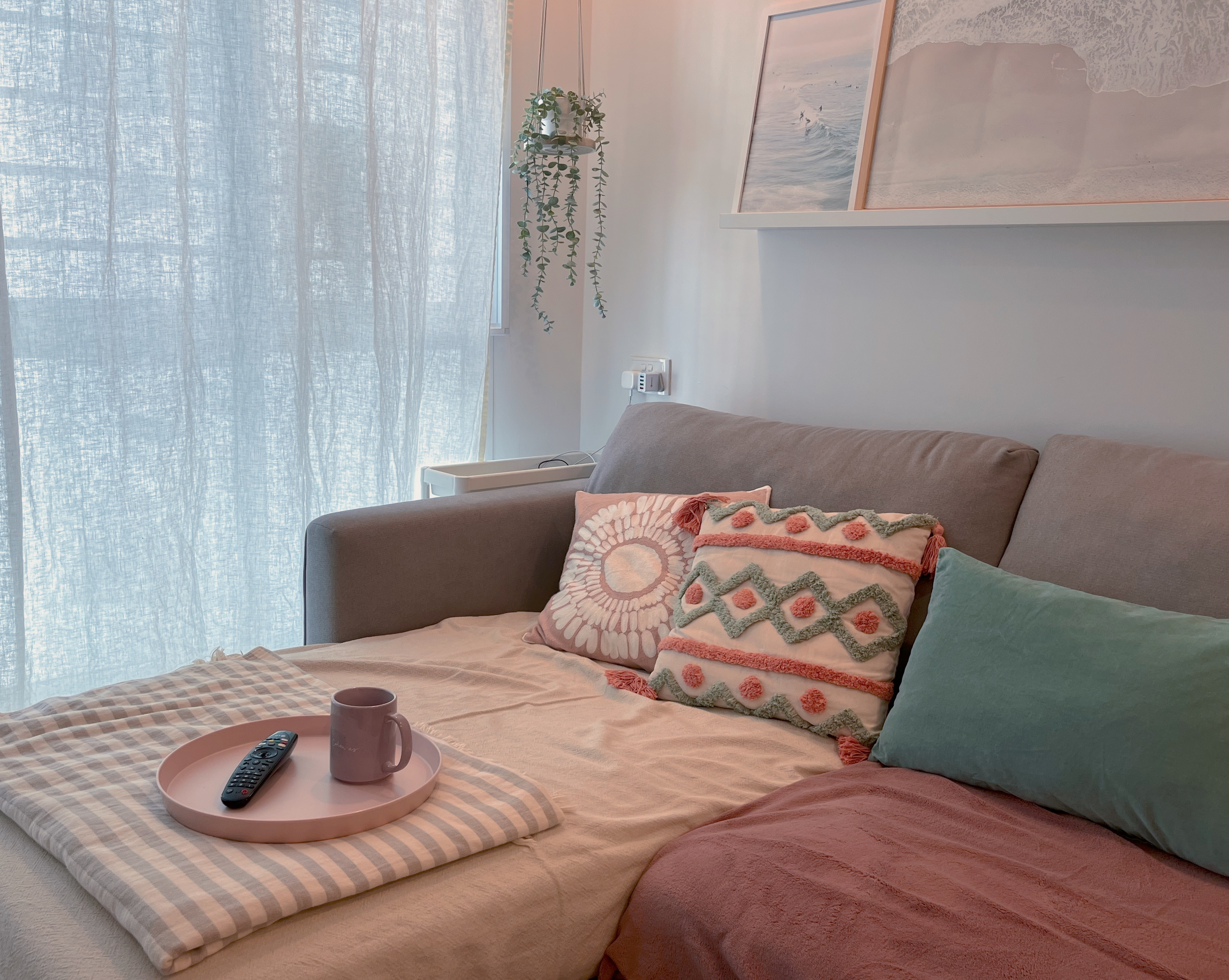 Living In A Cosy 3-room Flat with Minimal Housekeeping - Soft, cozy living room with gray sofa, beige and pink throw pillows