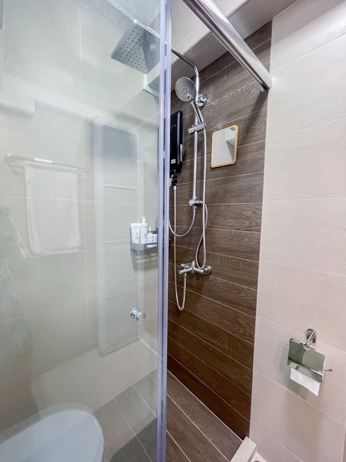 Modern Home for the Modern Interracial Couple - Glass shower enclosure, wooden panel wall, modern showerhead, handheld