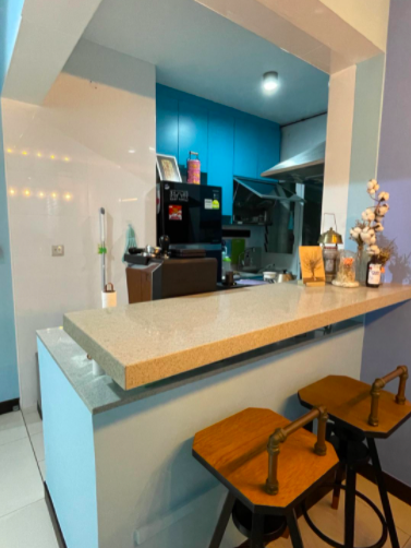 Our Colourful Personalities Imprinted On Our Apartment - Modern kitchen with blue cabinets, beige countertop, wooden bar