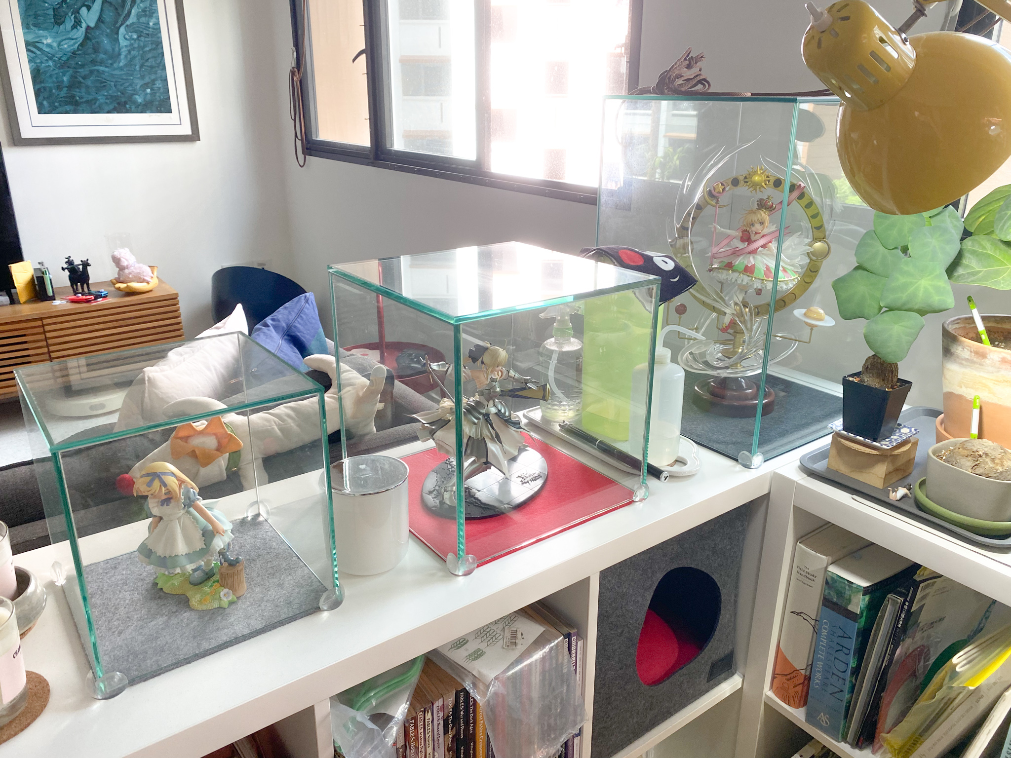 The Eccentricity of an Artistic Couple’s Apartment - Glass terrariums, indoor plants, decorative figurines, yellow sculpture