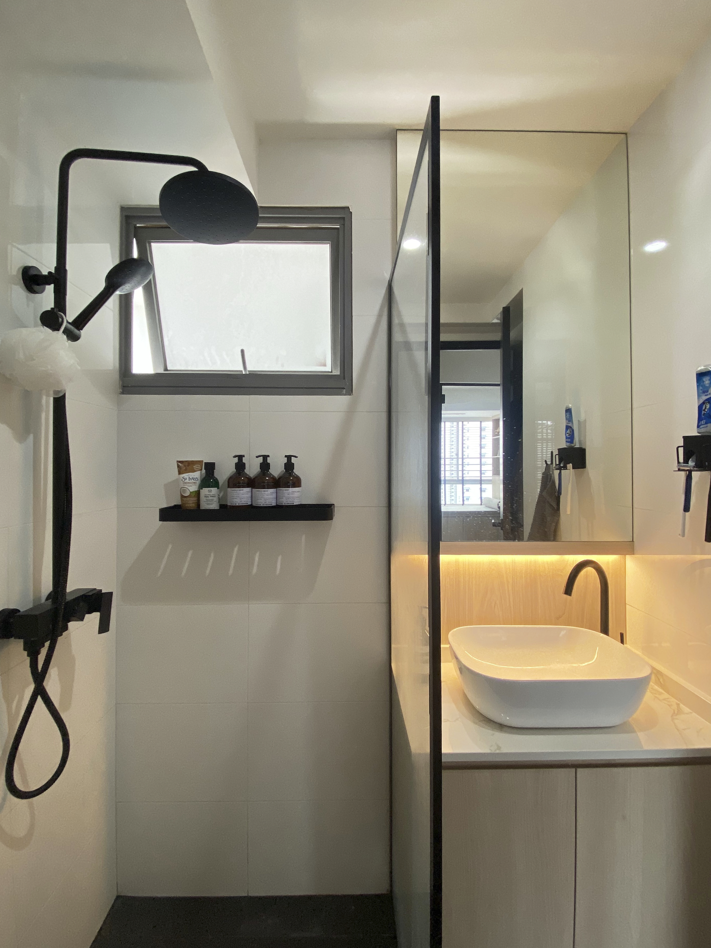 A Minimalist Apartment with an Urban Jungle - Modern minimalist bathroom, sleek design, large window, built-in sink, floating